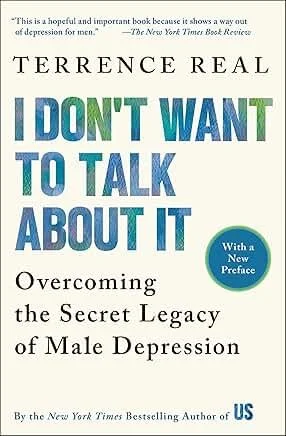Book cover of 'I Don't Want to Talk About It' by Terrence Real, with a quote from The New York Times Book Review at the top. The cover features a title in large, colorful letters and a circular blue label indicating a new preface, with additional text describing the book's topic on overcoming male depression.
