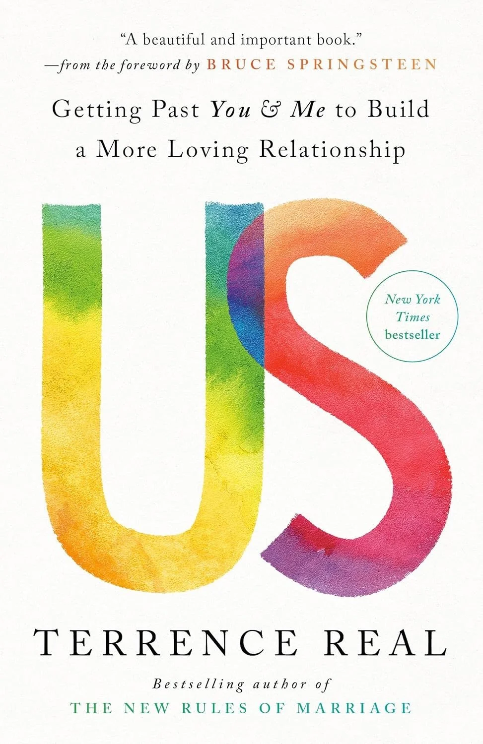 The book cover for "Getting Past You & Me to Build a More Loving Relationship" by Terrence Real, featuring a colorful watercolor-style illustration of the title "US" and a circle indicating it is a New York Times bestseller.
