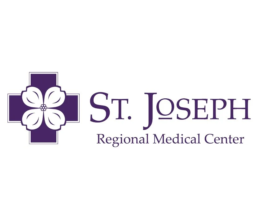 Logo of St. Joseph Regional Medical Center featuring a purple cross with a white flower at its center and the text "St. Joseph" and "Regional Medical Center" in purple.