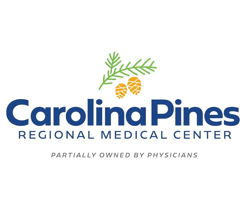 Logo of Carolina Pines Regional Medical Center with pine branch and pinecones above the text, and the tagline 'Partially owned by physicians' below.