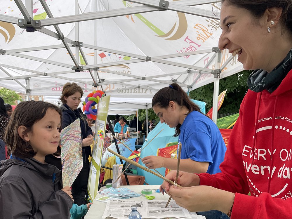 Tineke helps a resident make a kite at Atlantic Kite Festival