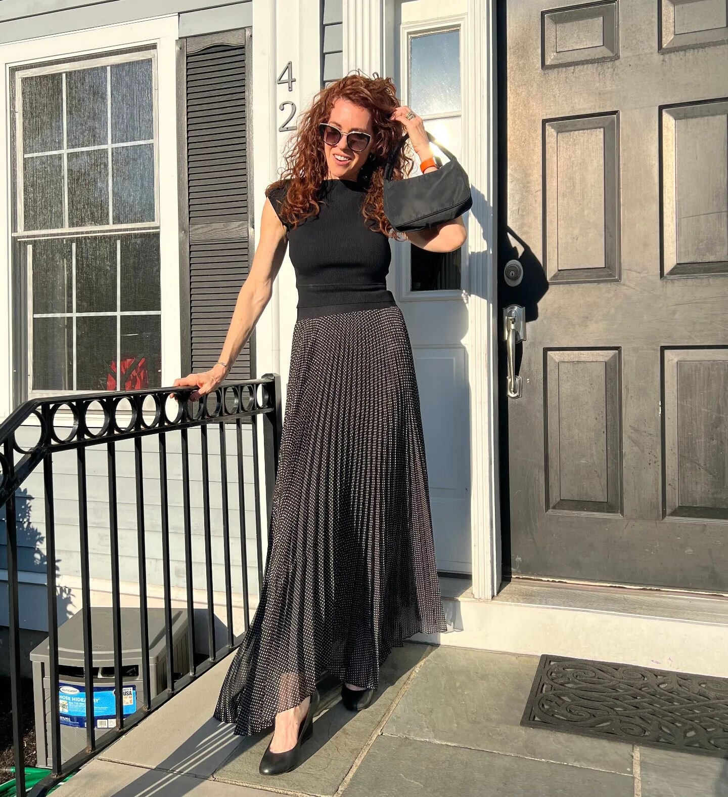 Dressing up a little for an evening out on a gorgeous spring day!  This is how I do black in the spring:  The polka dots on the pleated skirt add lightness to the black knit.  Finished off with classic black pumps.  Fashion tip of the day - buy quali