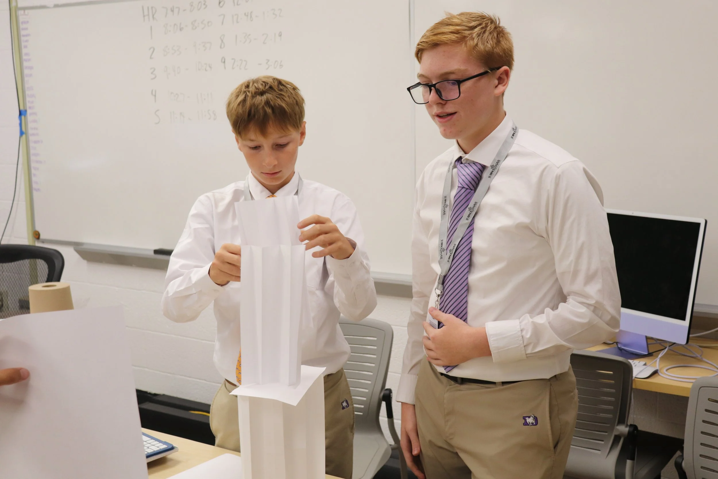 tudents collaborating in a Computer Science class at St. Francis DeSales High School