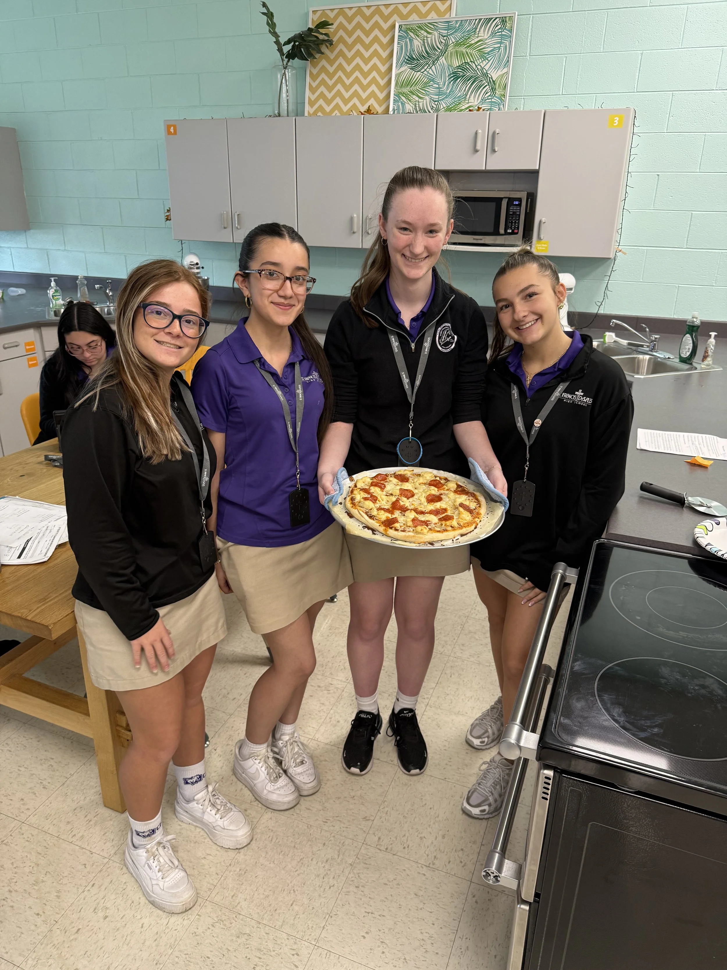 Students collaborating in a Family And Consumer class at St. Francis DeSales High School