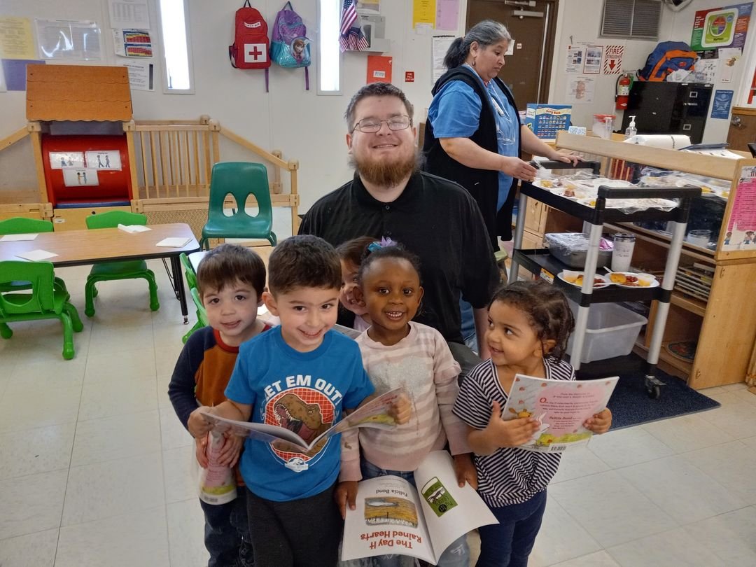  Librarian Kolten read to the children at Hollis Early Head Start and gave each child a book for their parent to read to them at home. 