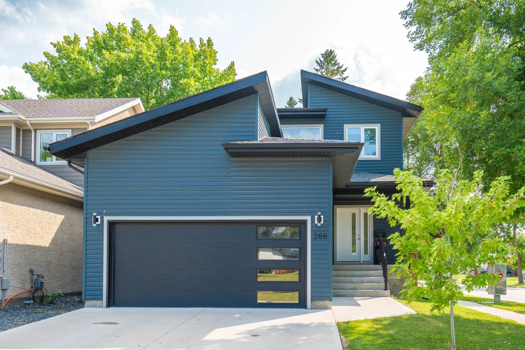 Houses for Sale Winnipeg — The Moore Group Your Winnipeg Realtors