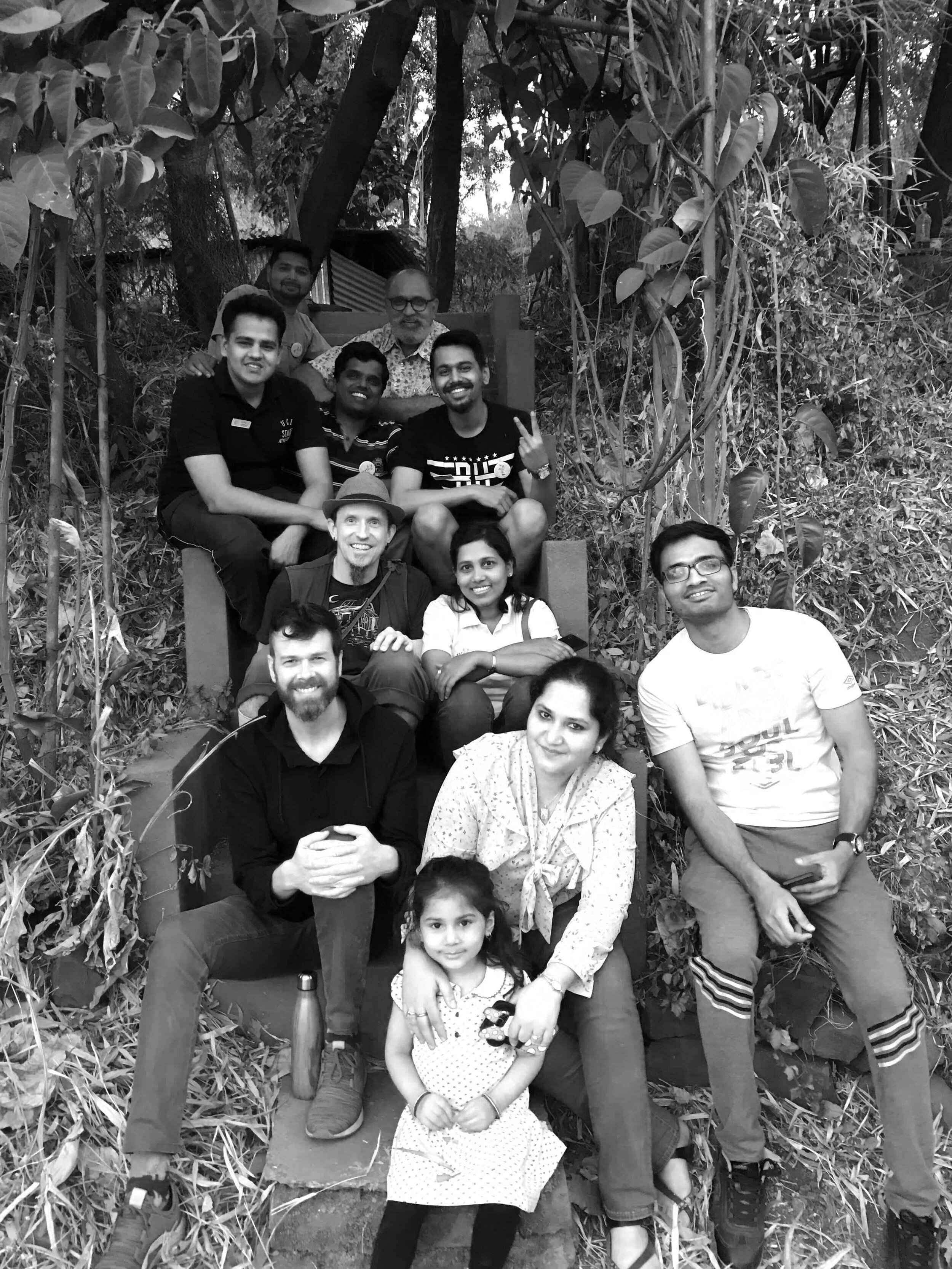 Indian families sitting on staircase