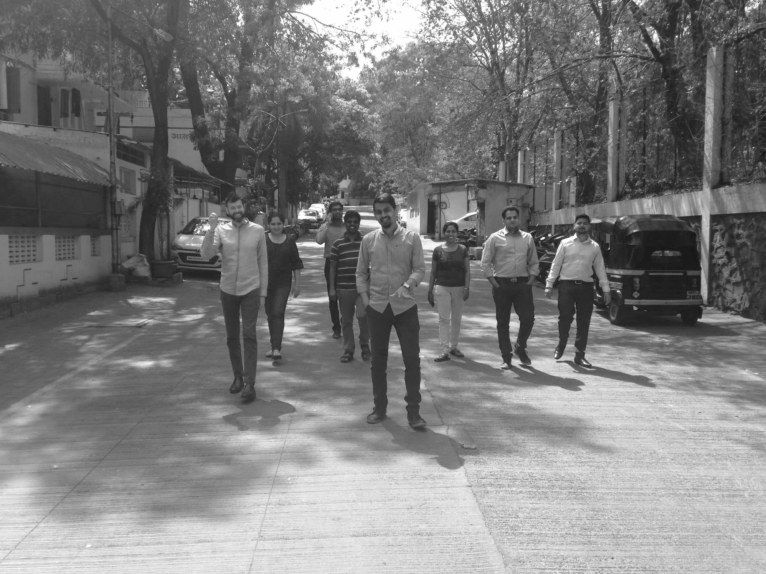 team posing on Indian street
