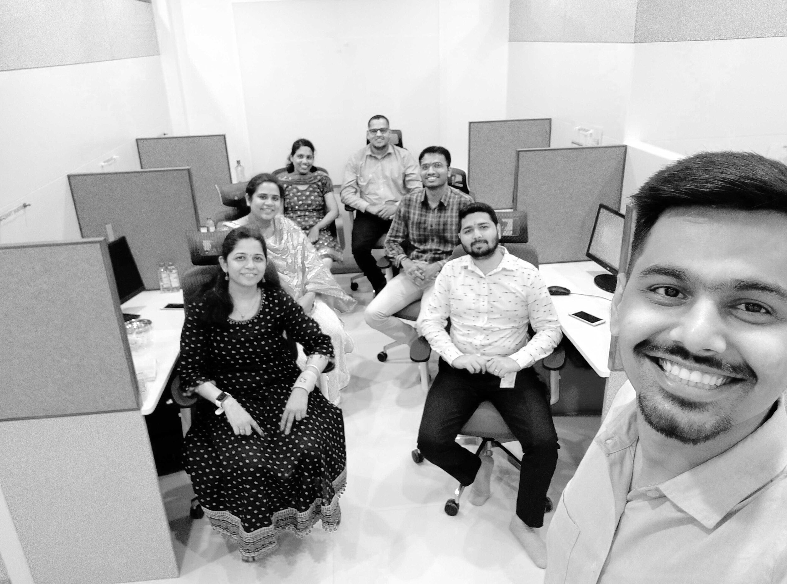 India team posing in cubicles