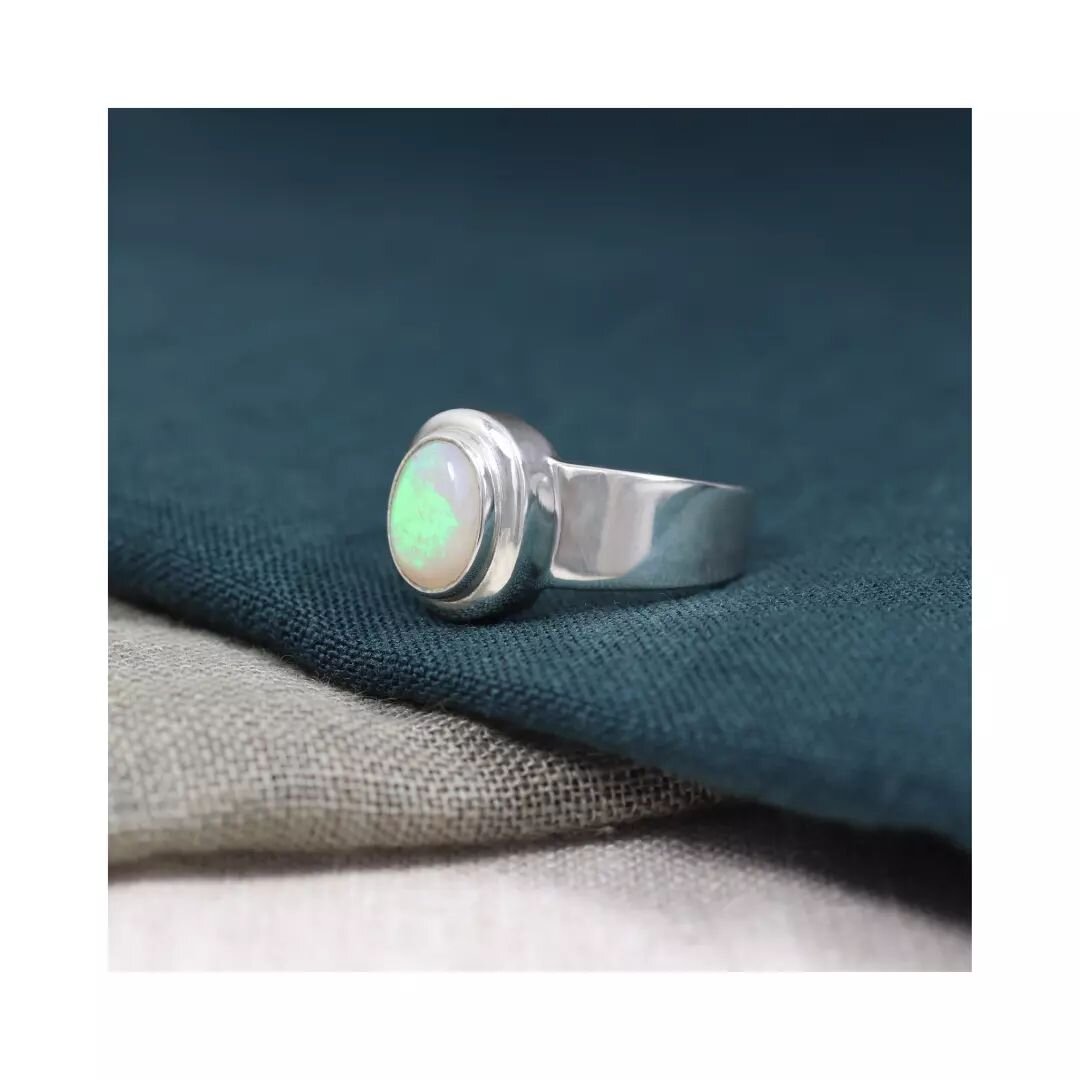 M I A - a bold statement ring in a sleek contemporary style featuring&nbsp;a double bezel and wide flat shank. This ready to wear Mia is sterling silver and features a 1.05ct oval cabochon Australian crystal opal 

In store now

#opallove #australian