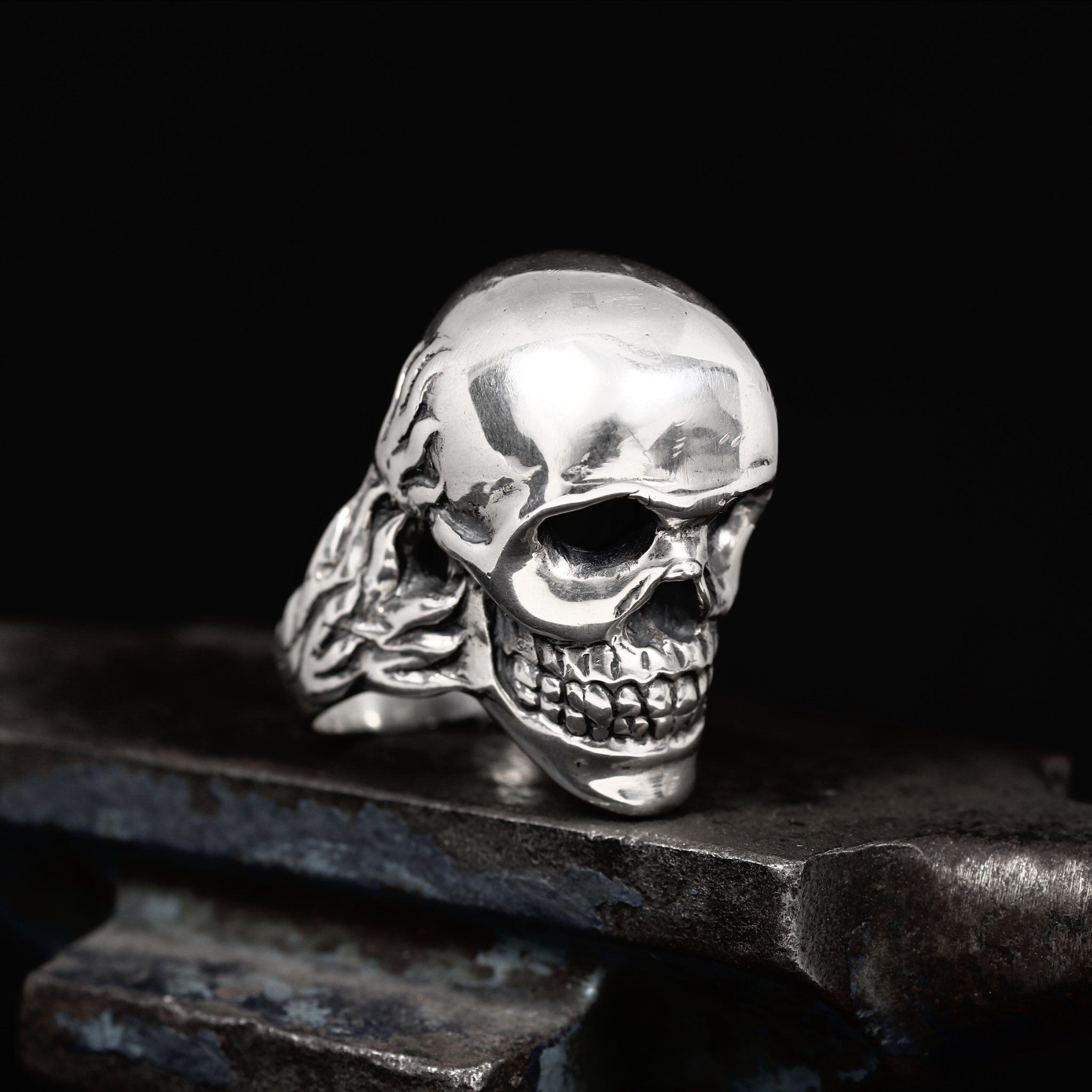 Solid skull ring sterling silver. And when I say solid, I mean it. At just over 80g (just under 8oz), this is one of the biggest rings in the collection. You could get our Demon Ring which comes in at about 10g heavier to balance yourself out on the 