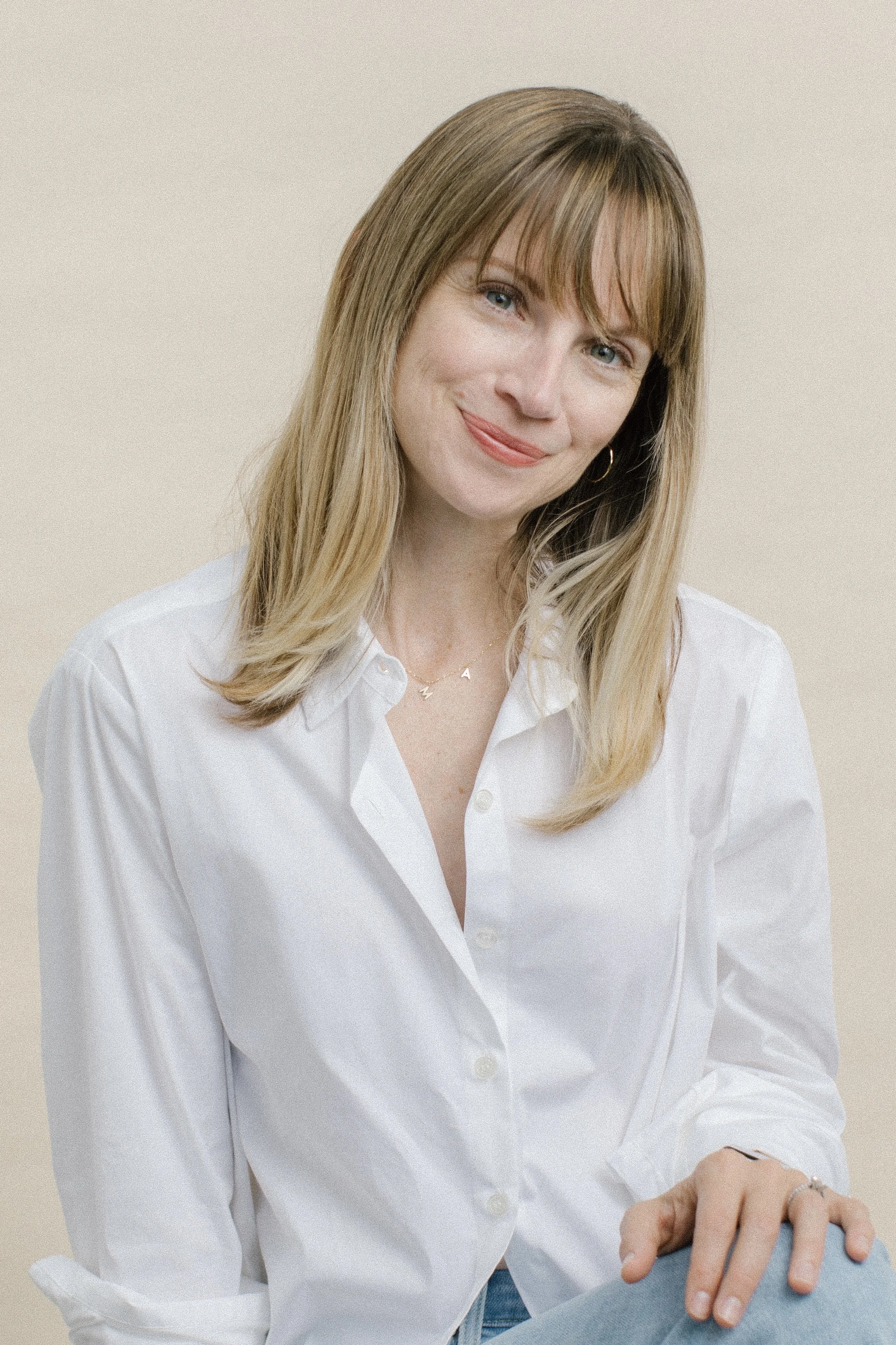 Founder, Molly Normand LMFT headshot dressed in a white blouse