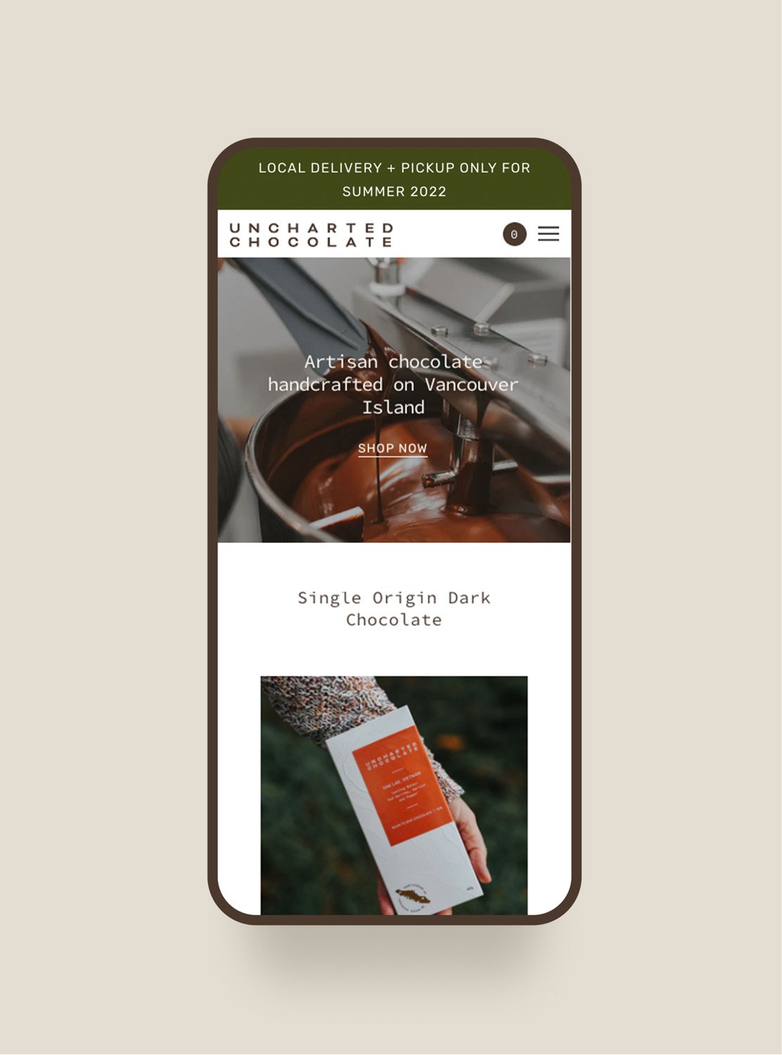 Shopify website design for Uncharted Chocolate mocked up on an iPhone