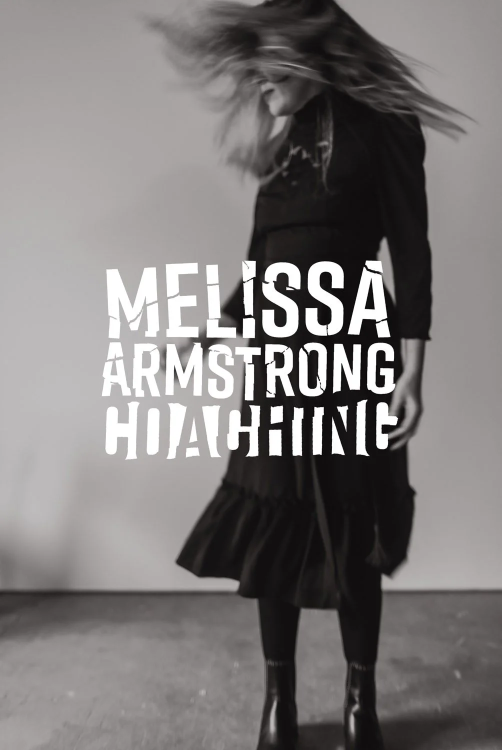 A woman with long hair wearing a dark outfit and boots, her hair flying as she moves, with overlaid text that reads "Melissa Armstrong Hiding" in distressed fonts.
