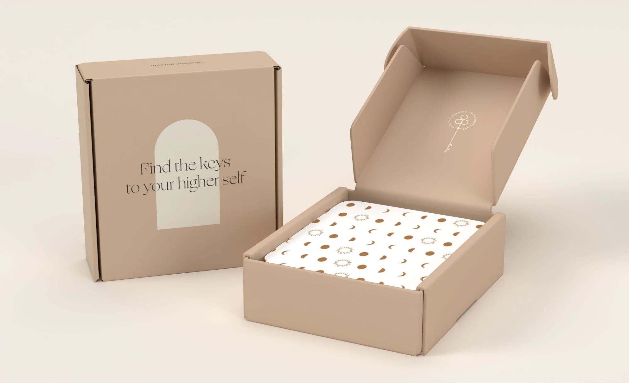 Natalie Kehren branded mailer box reading "Find the keys to your higher self," packaging design by Moonstone Creative brand designer