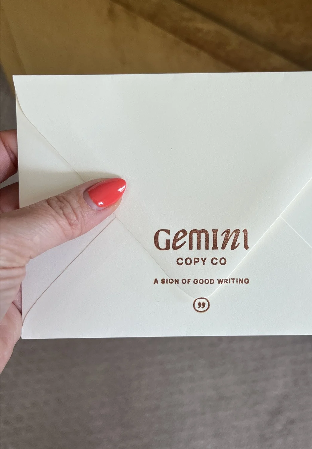 Gemini Copy Co envelope featuring the refreshed logo stamped in brown ink