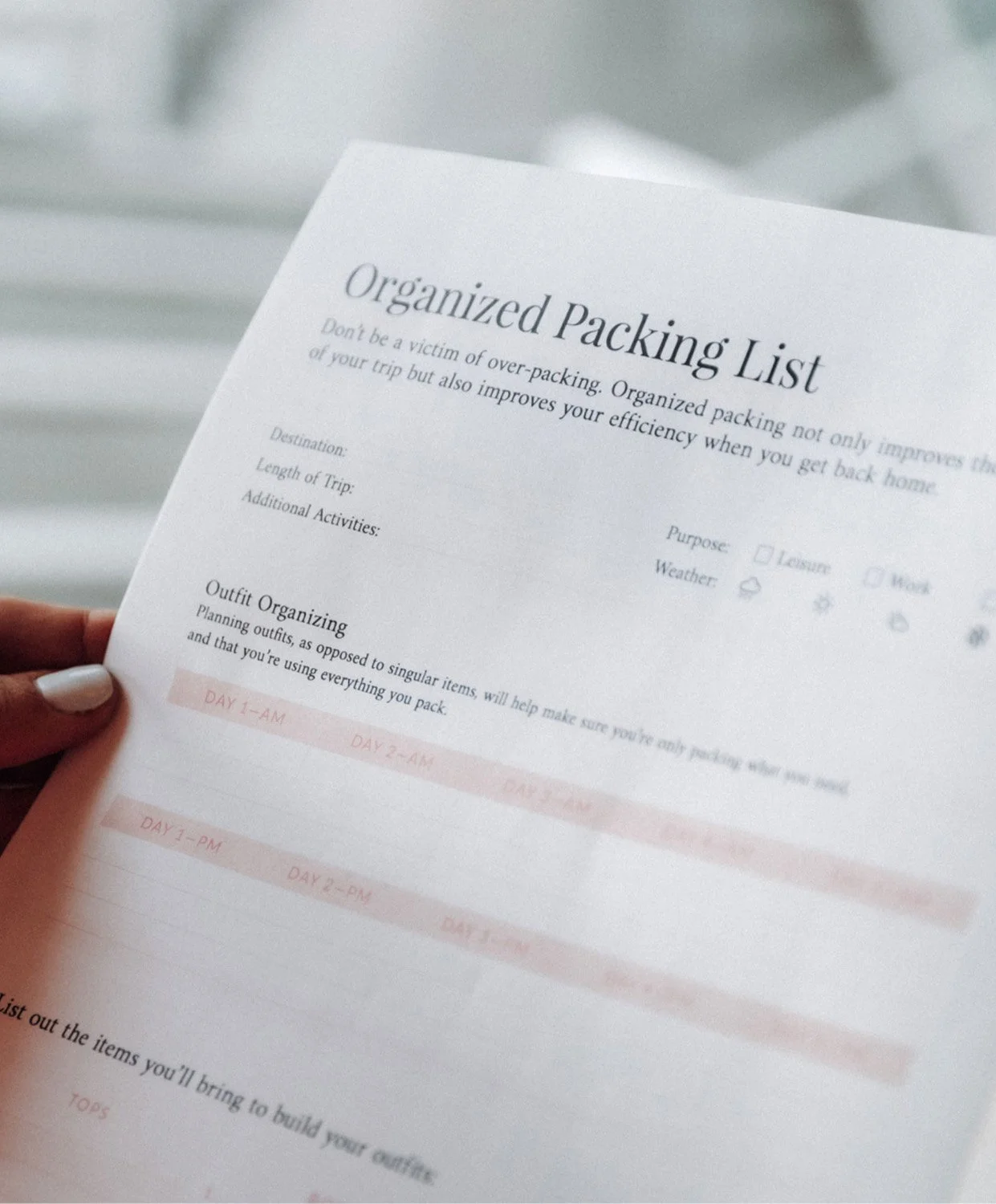 Organized Jane branded packing list print design held in hand showing outfit organizing layout designed by Moonstone Creative