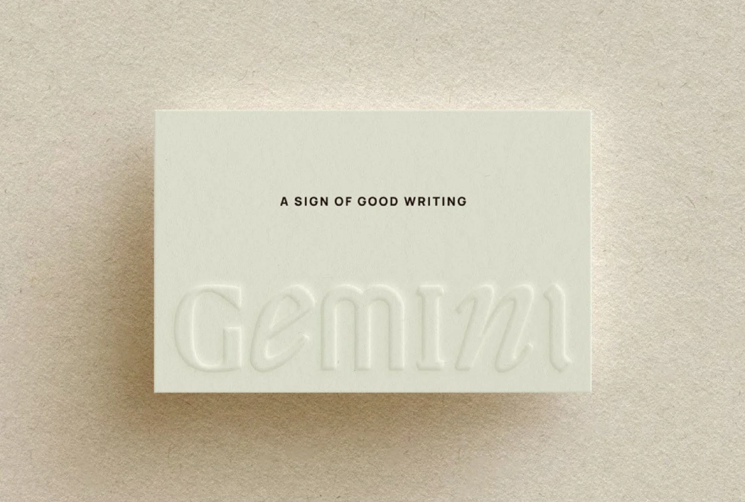 Embossed Gemini Copy Co brand card with editorial typography and the tagline “A Sign of Good Writing”