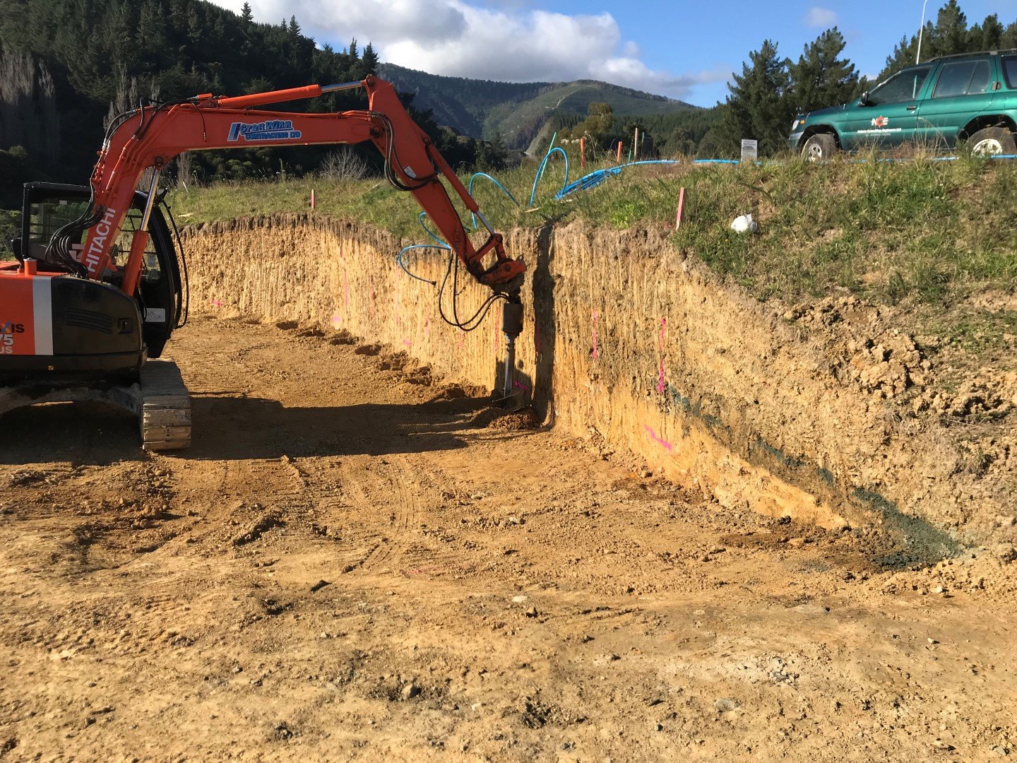  Augering for a timber pole retaining g wall 
