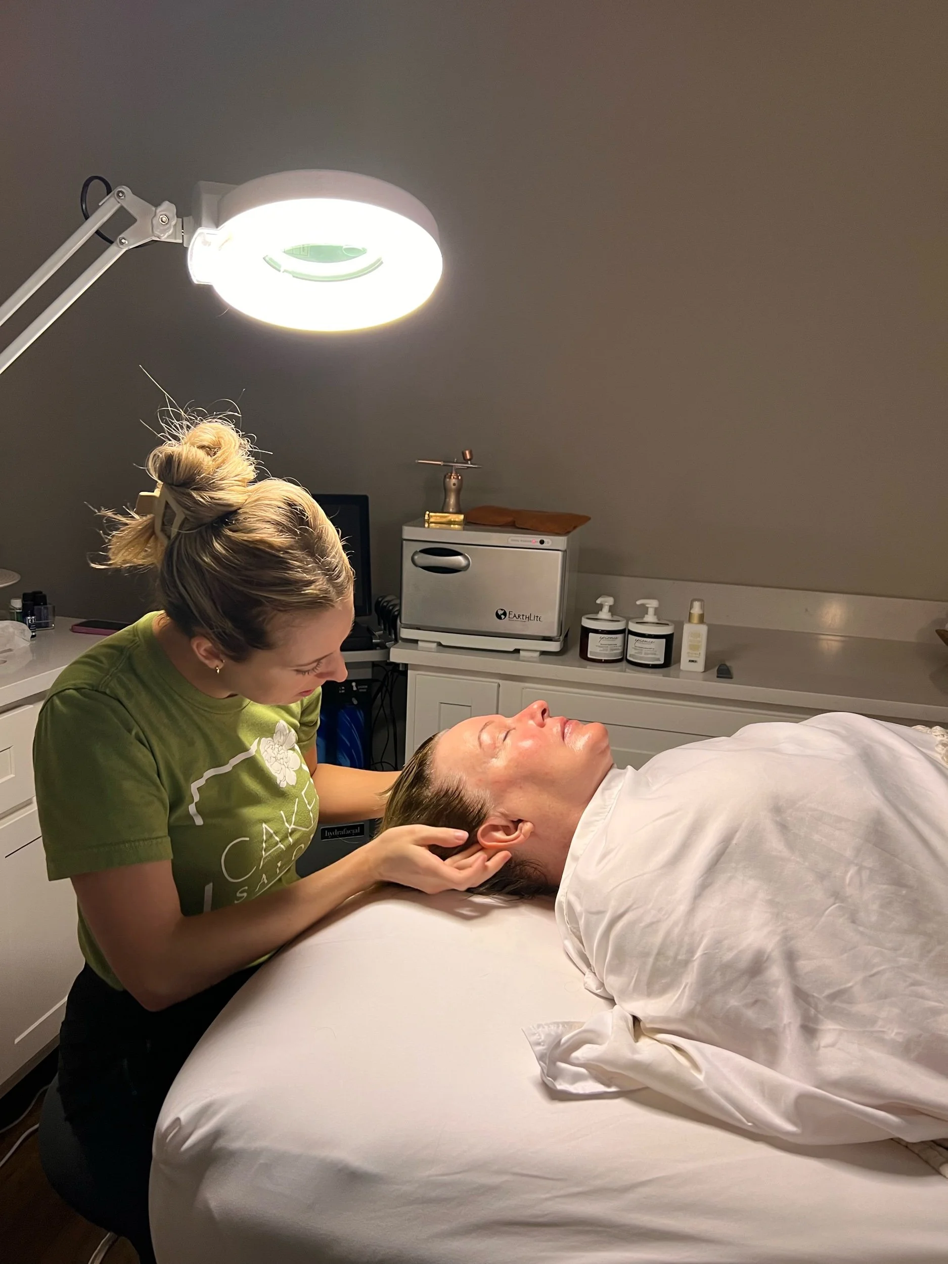 OKC Esthetician during luxury facial treatment
