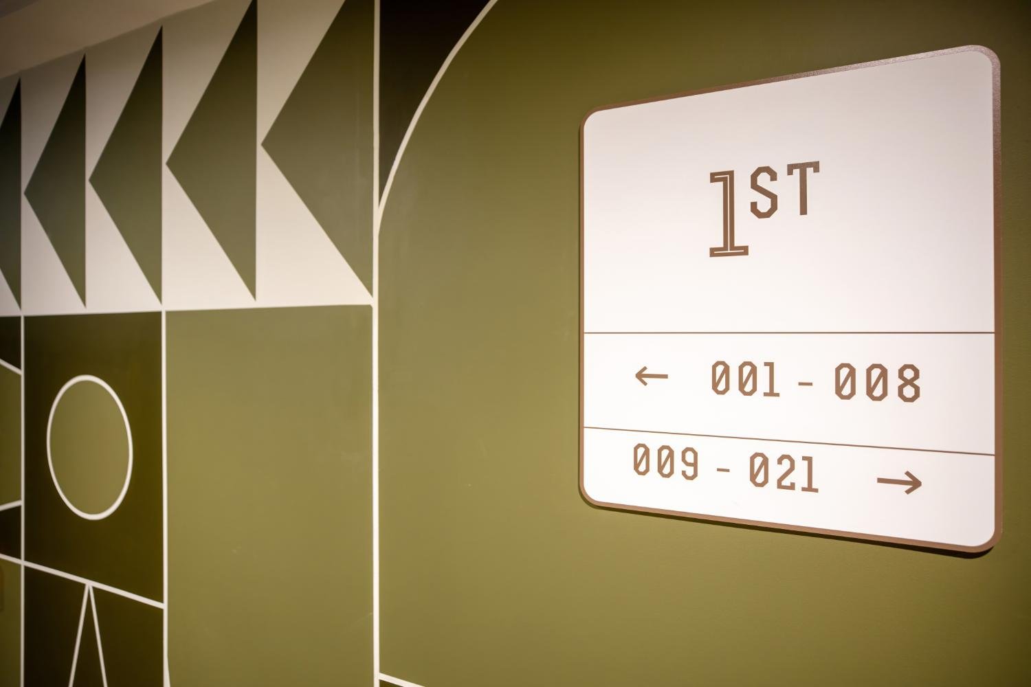 Internal wayfinding signage at The Rex residential development