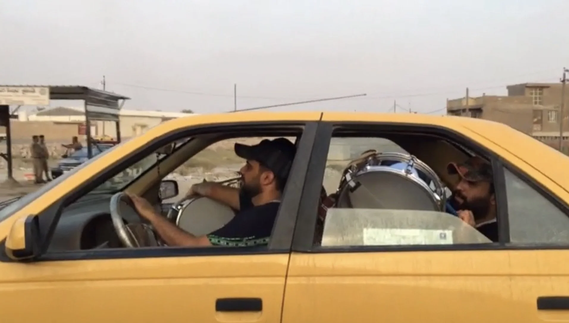 Taking yellow street taxis in Iraq
