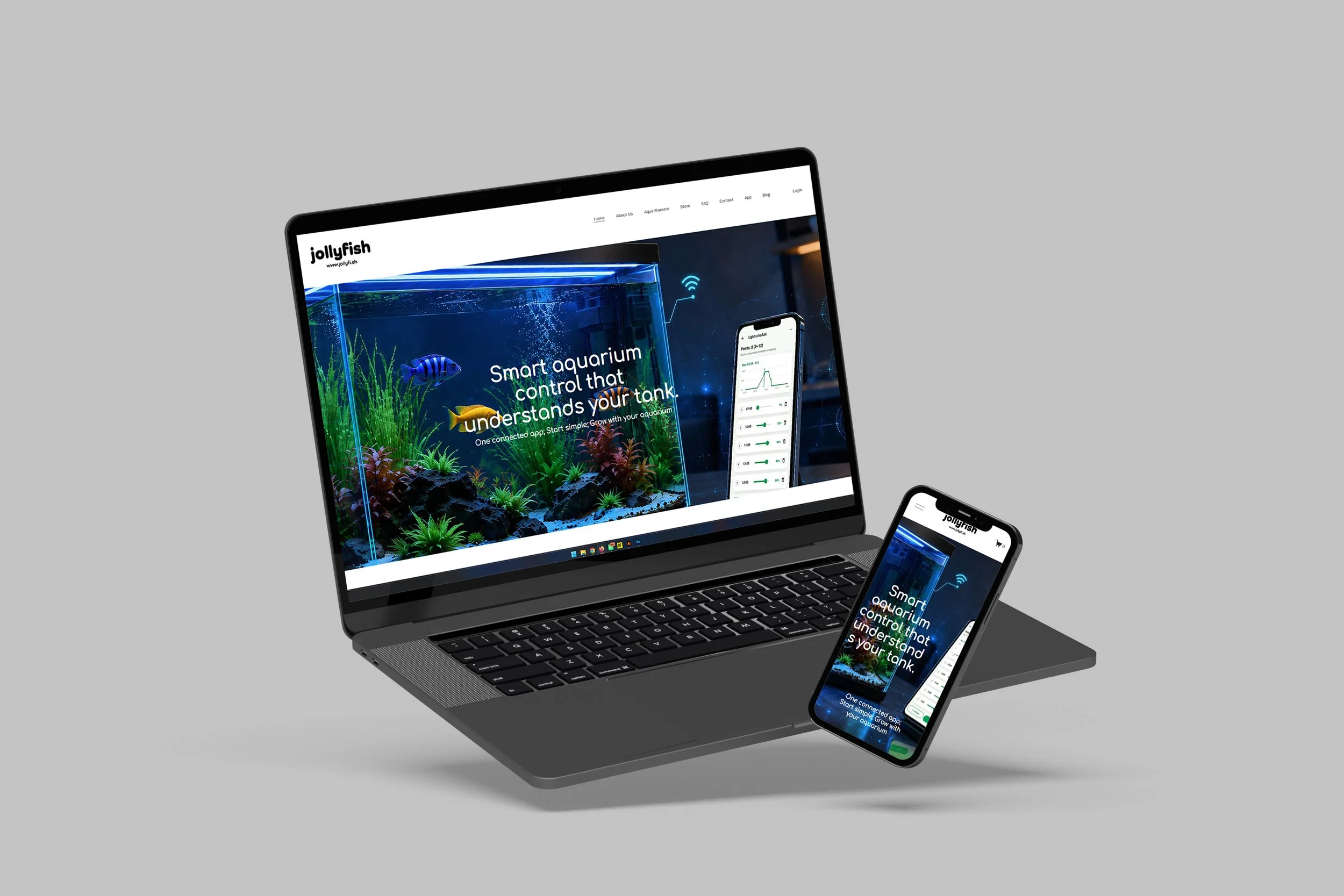 Laptop and smartphone displaying a website about smart aquarium control on a gray background.