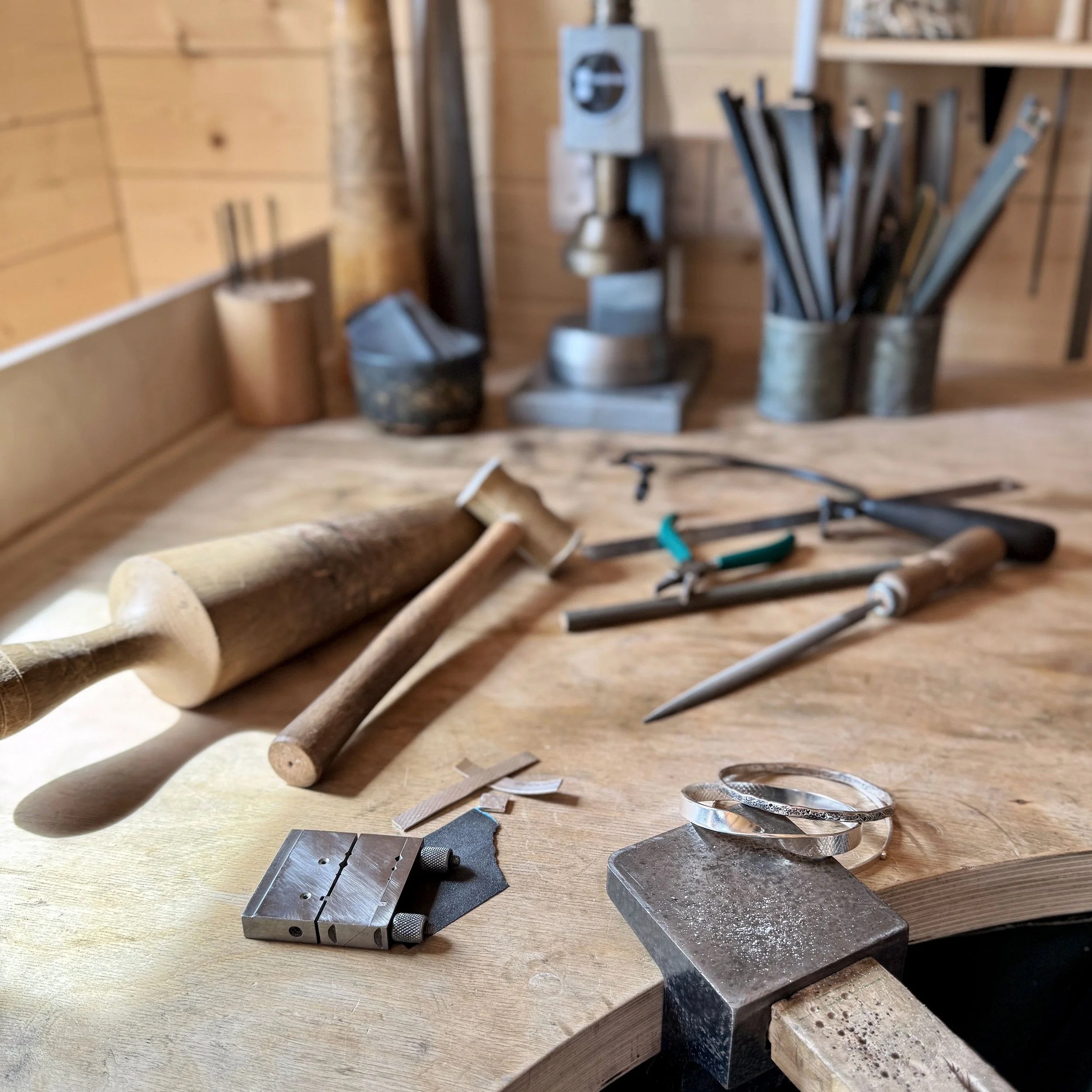 Jewellery work bench with tools and finished bangles