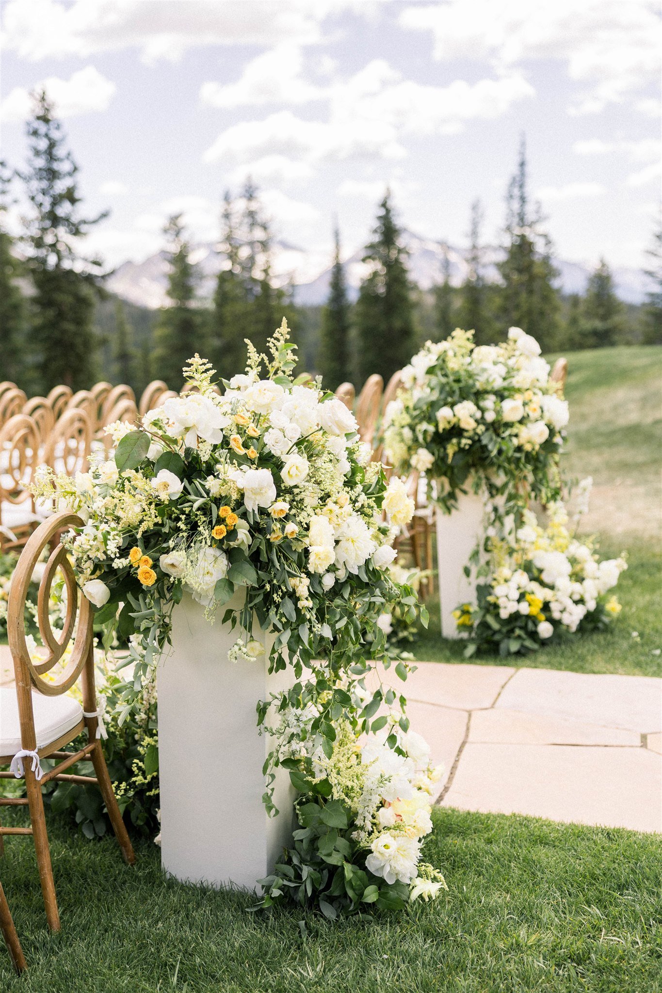  White and yellow aisle florals for Telluride weddings 