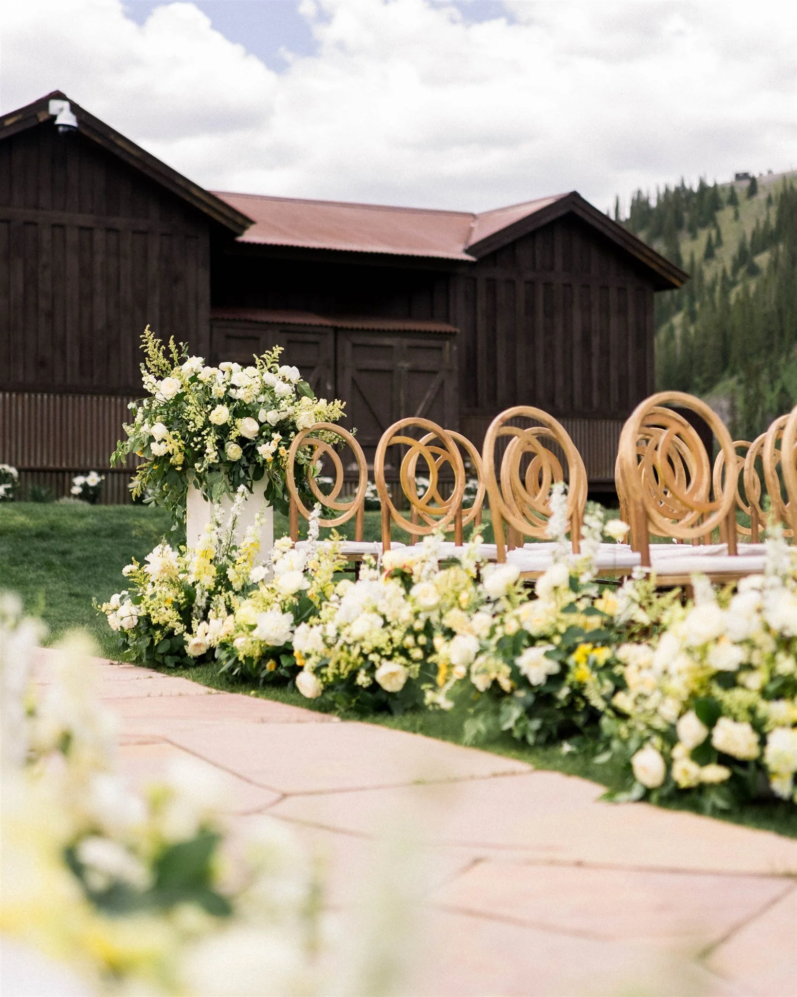  White and yellow ground aisle florals in Colorado 
