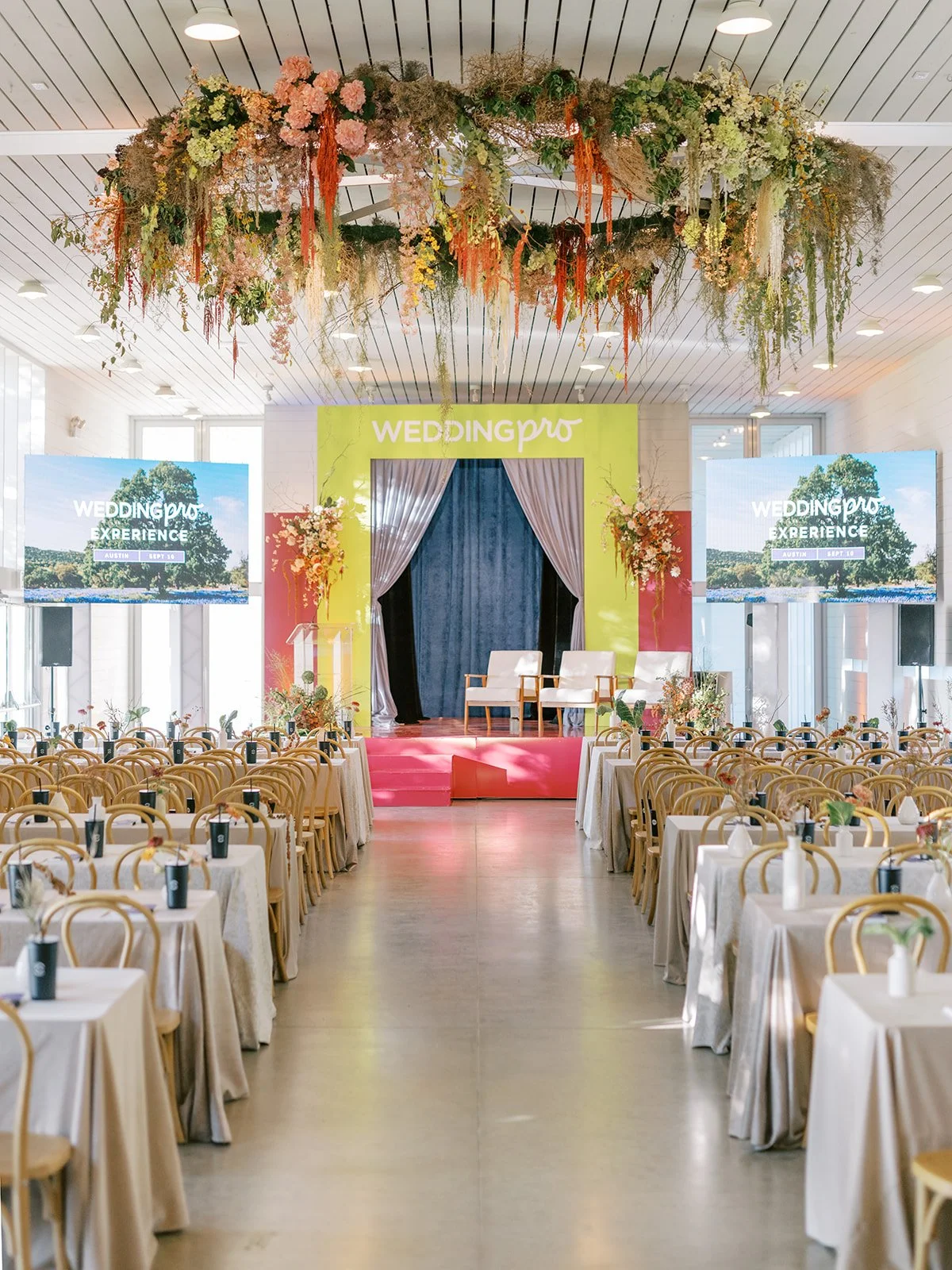  Austin corporate event florist ceiling installation over dinner tables. 