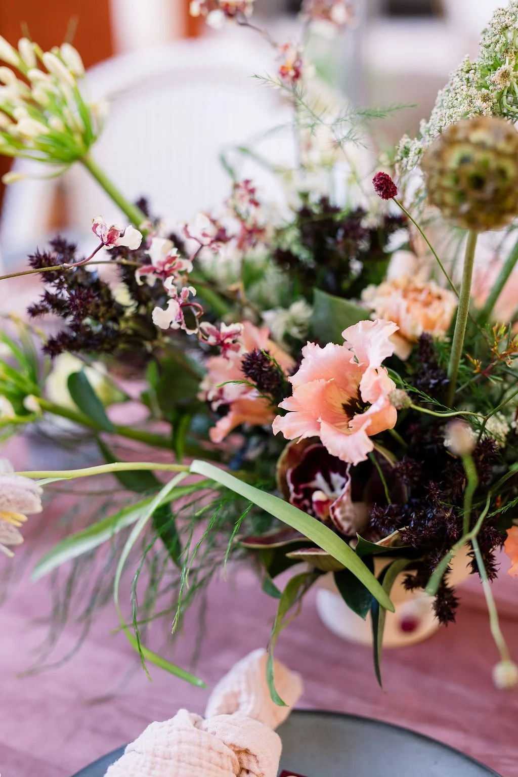  Gorgeous and moody floral centerpiece designed for an Austin corporate event. 