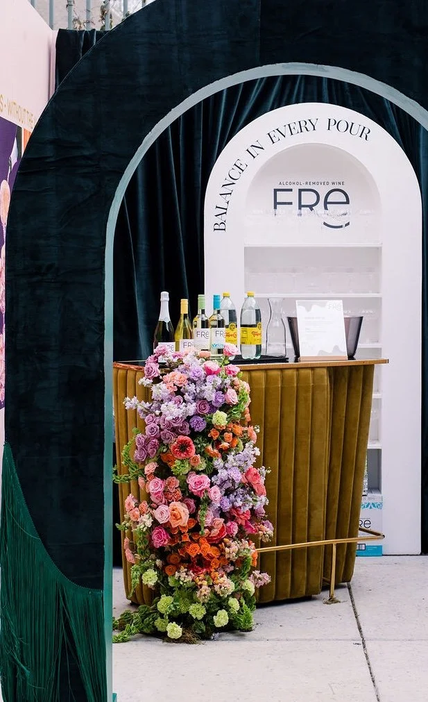  Lush flowers spilling down a bar front. 