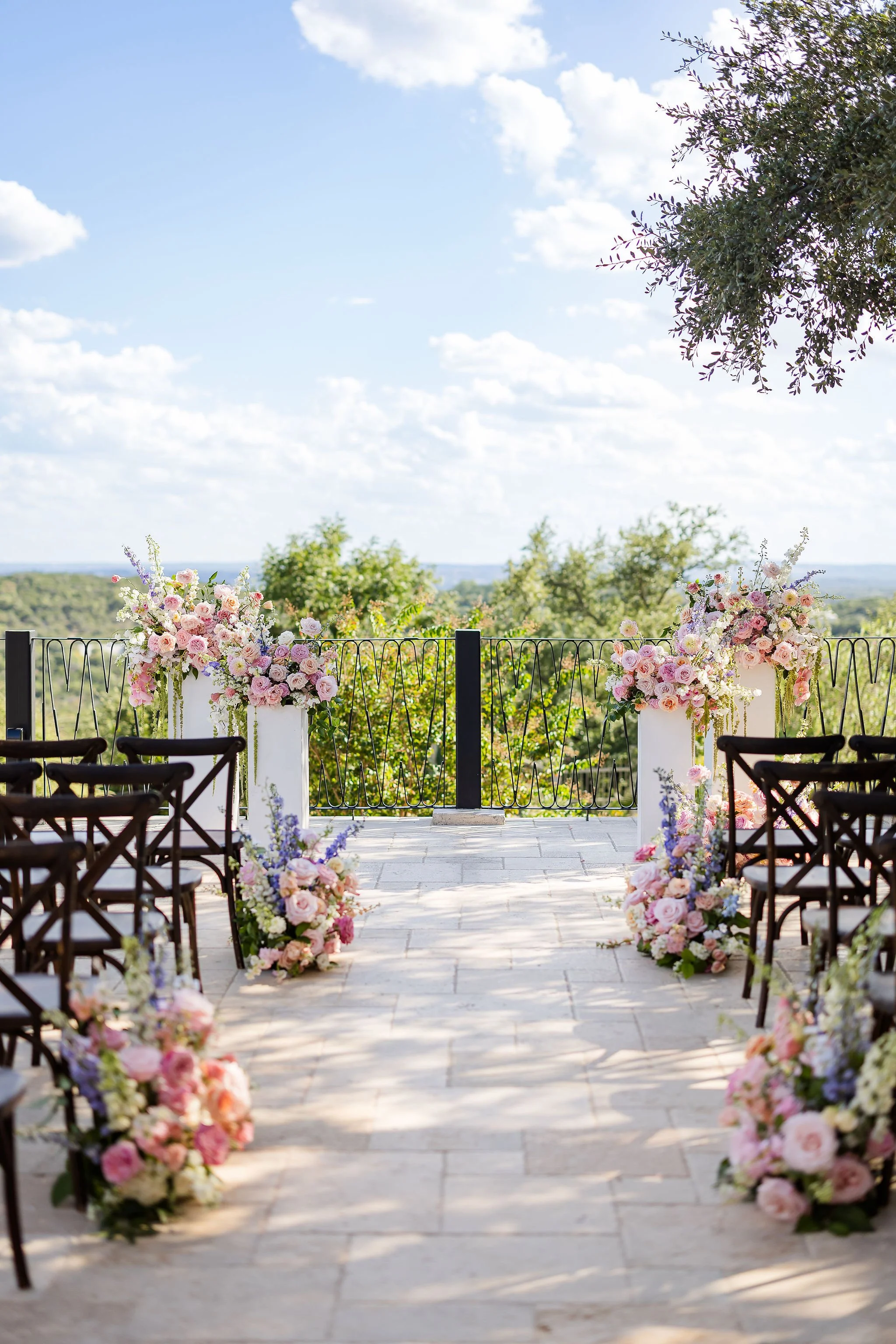  Outdoor wedding ceremony florals in shades of pastel. 