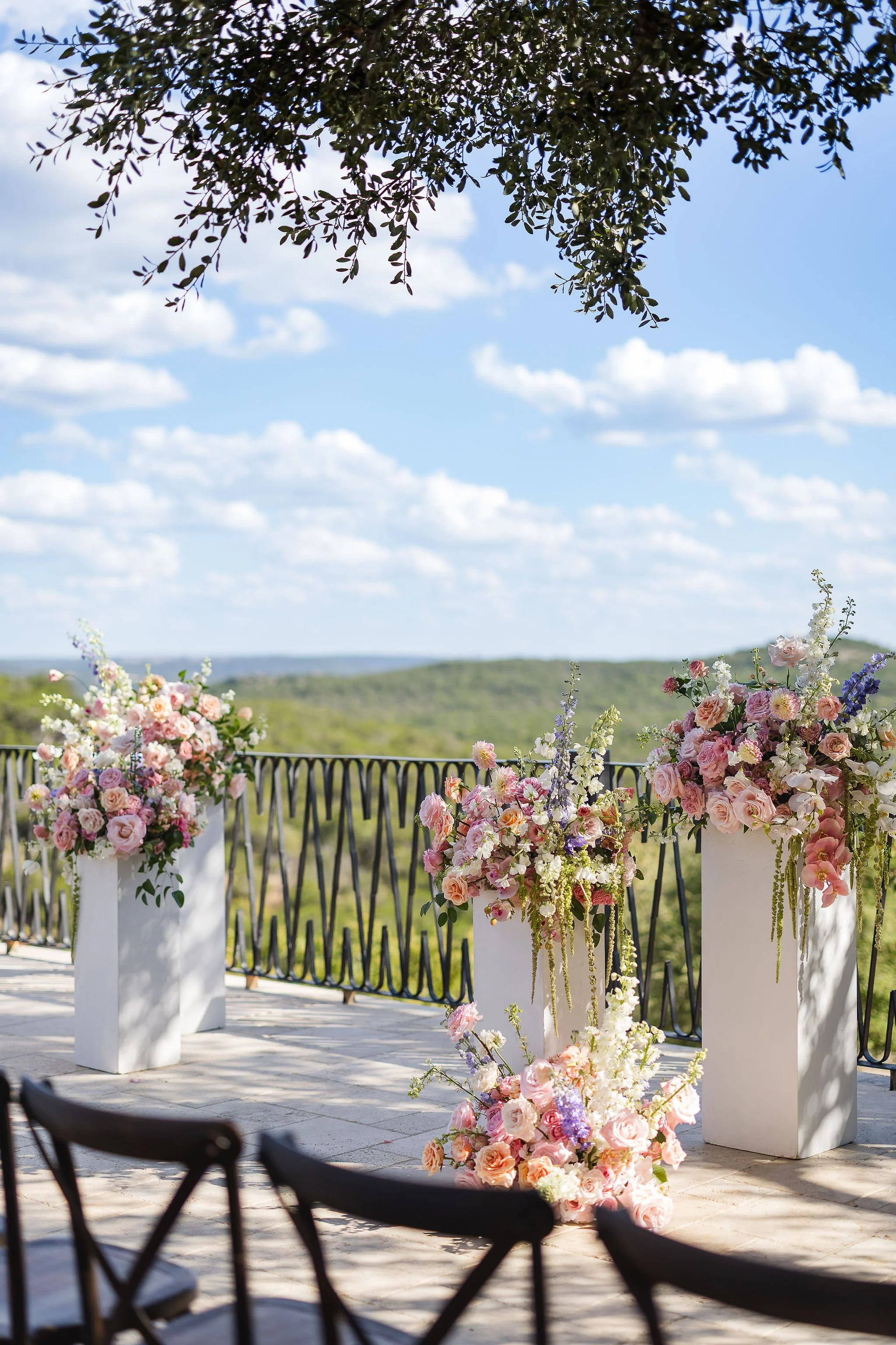 Pink florals at the wedding altar overlooking the Hill Country. 