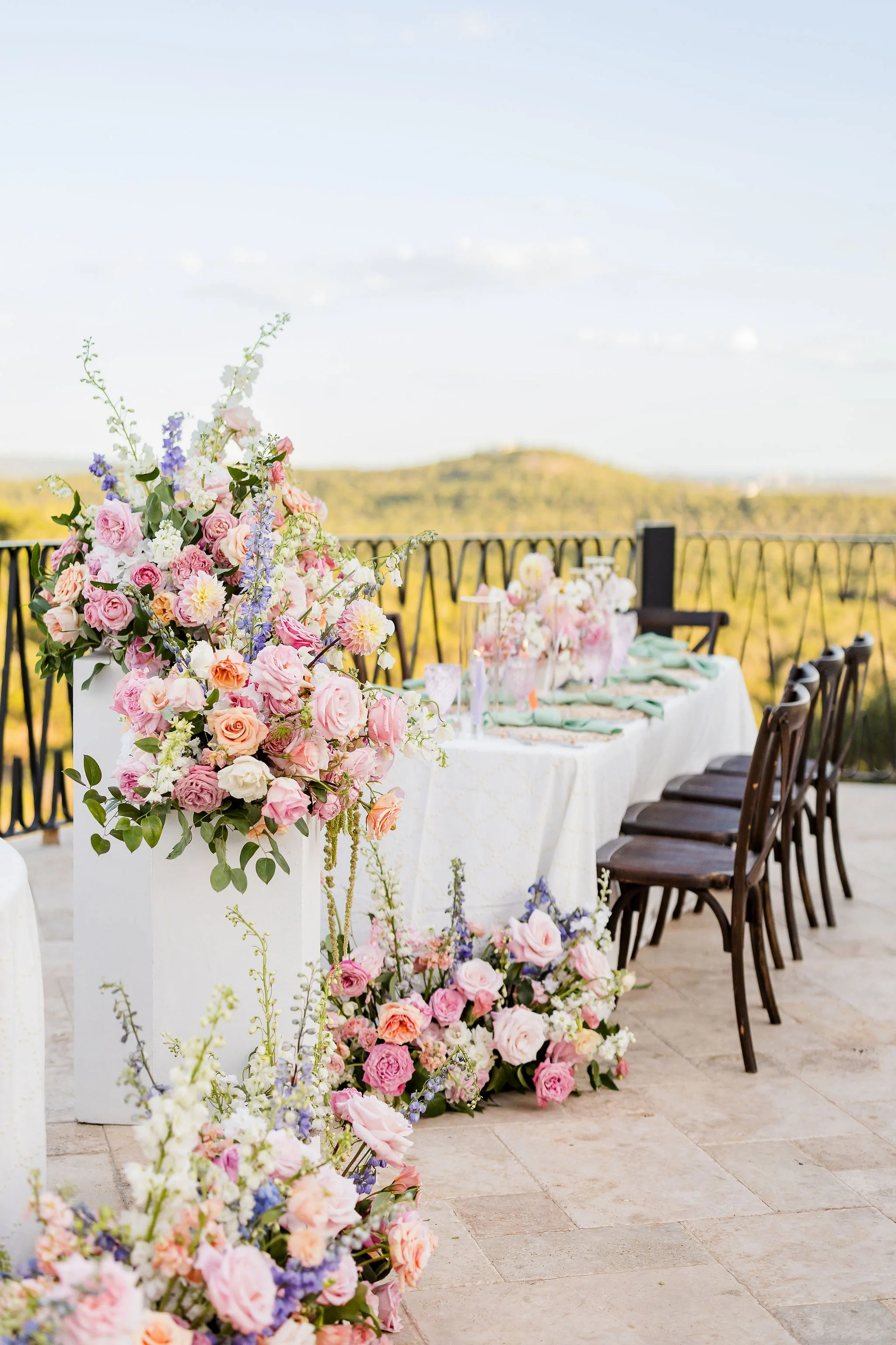  An outdoor wedding reception with florals in pastel shades. 