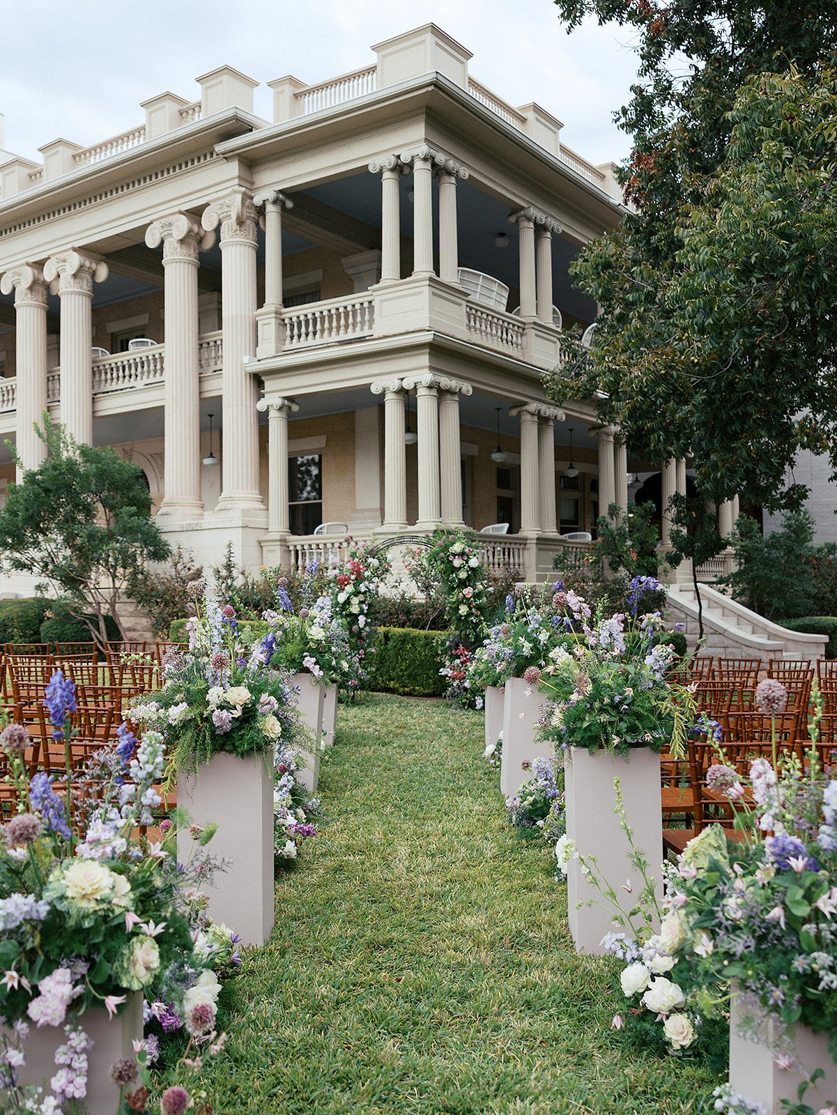  A purple hued wedding ceremony at historic hotel. 