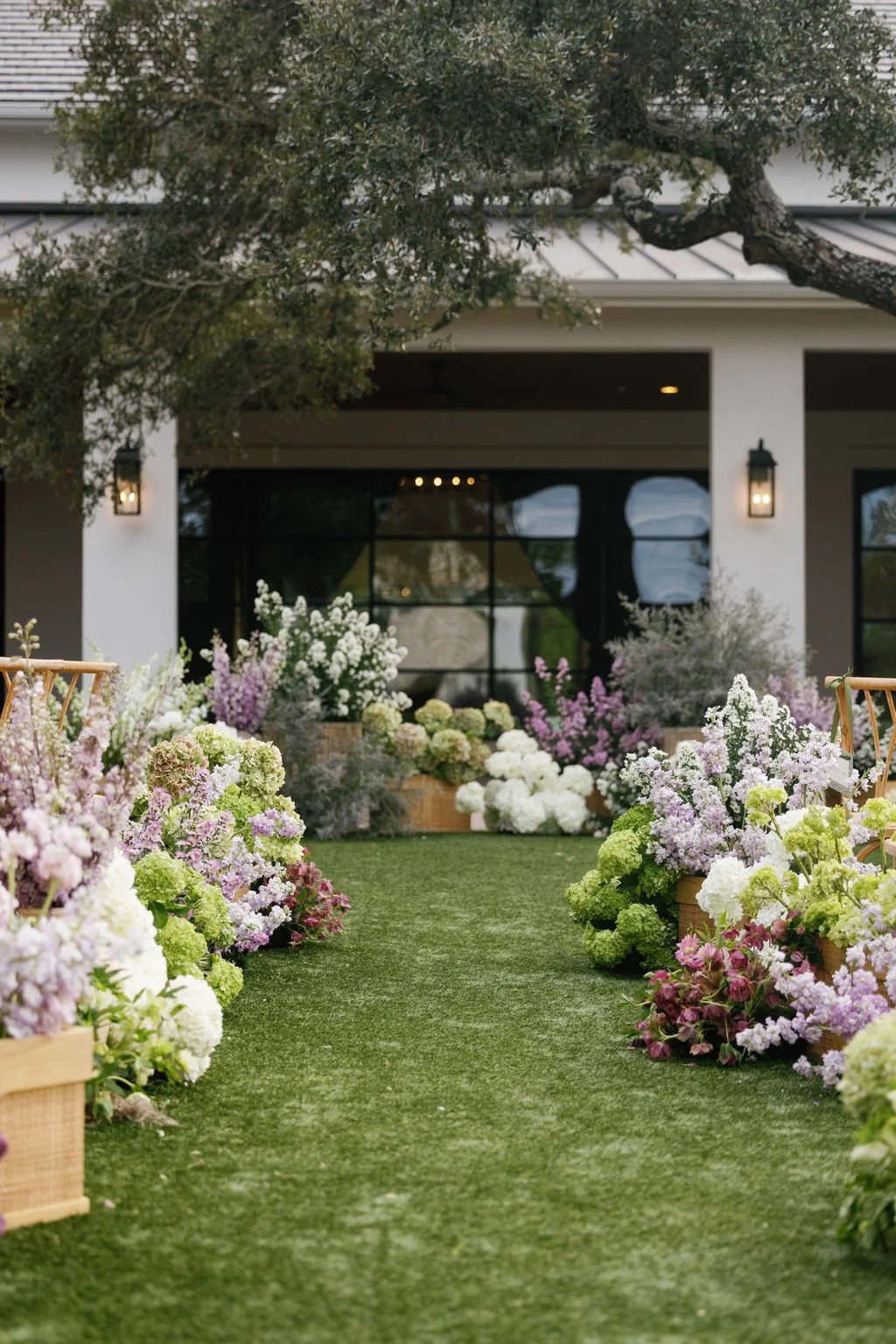  Outdoor wedding with layered florals down the aisle. 