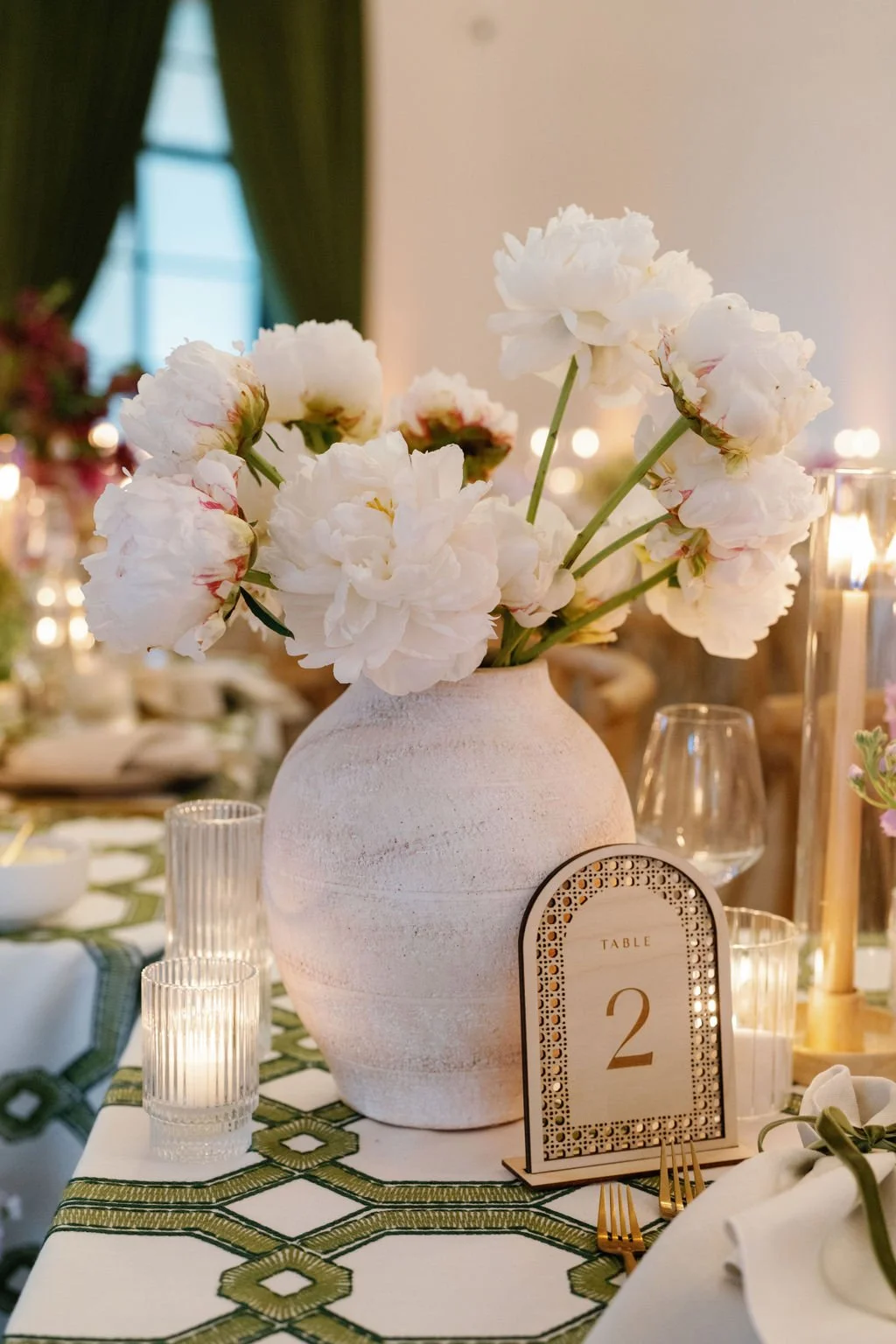  A vase full of fluffy peonies. 