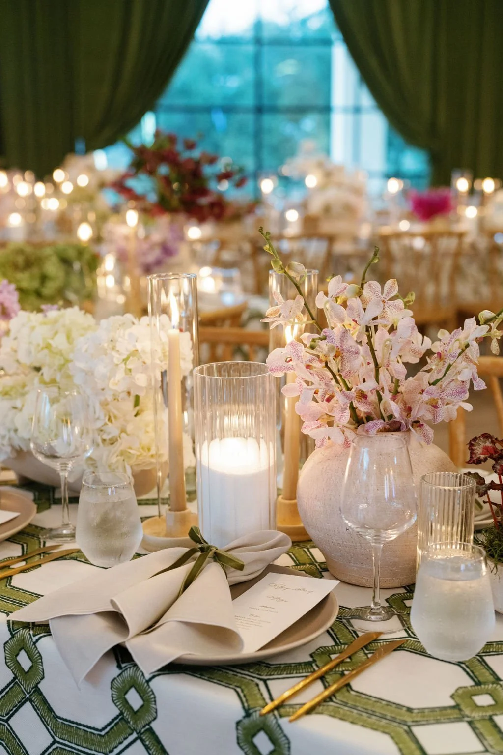  Wedding reception tables with monobotanical style centerpieces. 