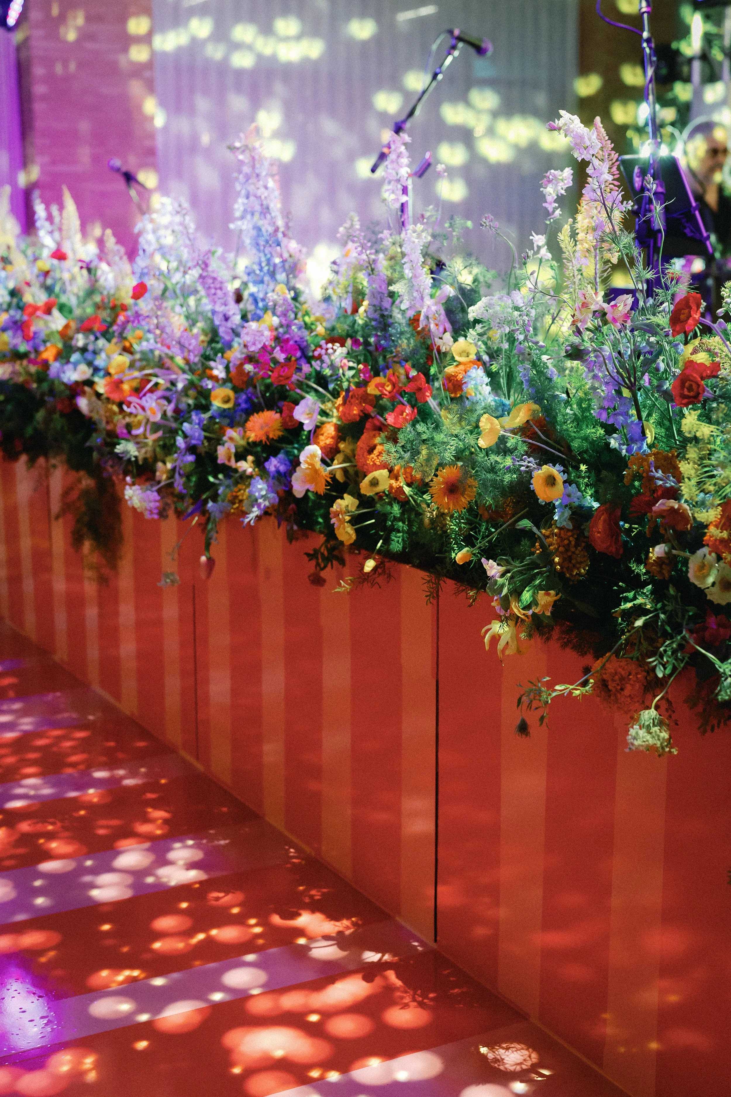  Close-up of the striped floral-topped stage ledge above the illuminated dance floor at Mattie's 