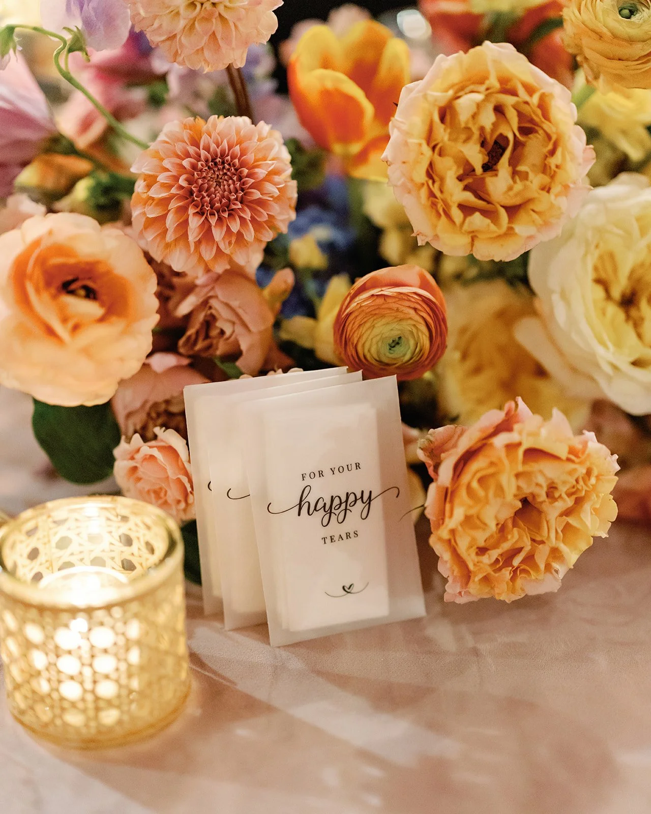  Close up centerpiece with a happy tears card and gold votive candle at Four Seasons Austin reception 