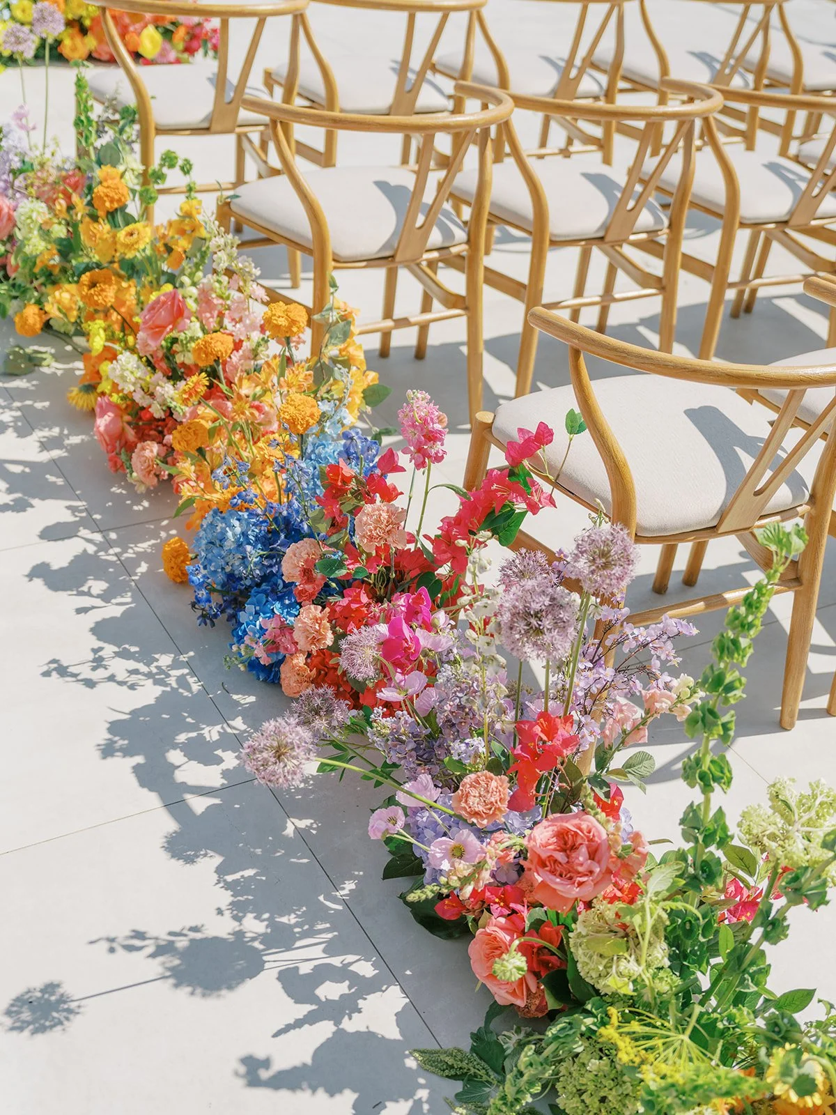  Color blocked bold florals for wedding aisle 