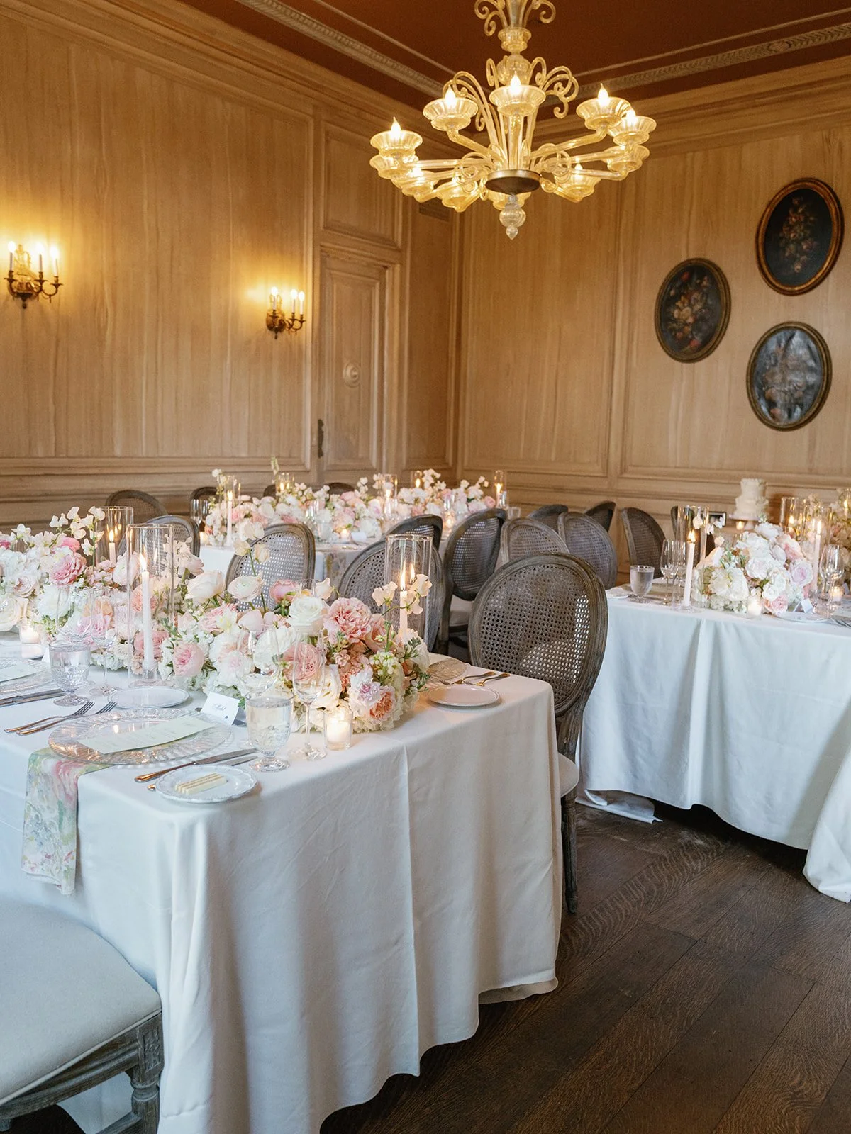  Soft peach and blush reception centerpieces glowing by candlelight at a Commodore Perry Estate wedding in Austin 