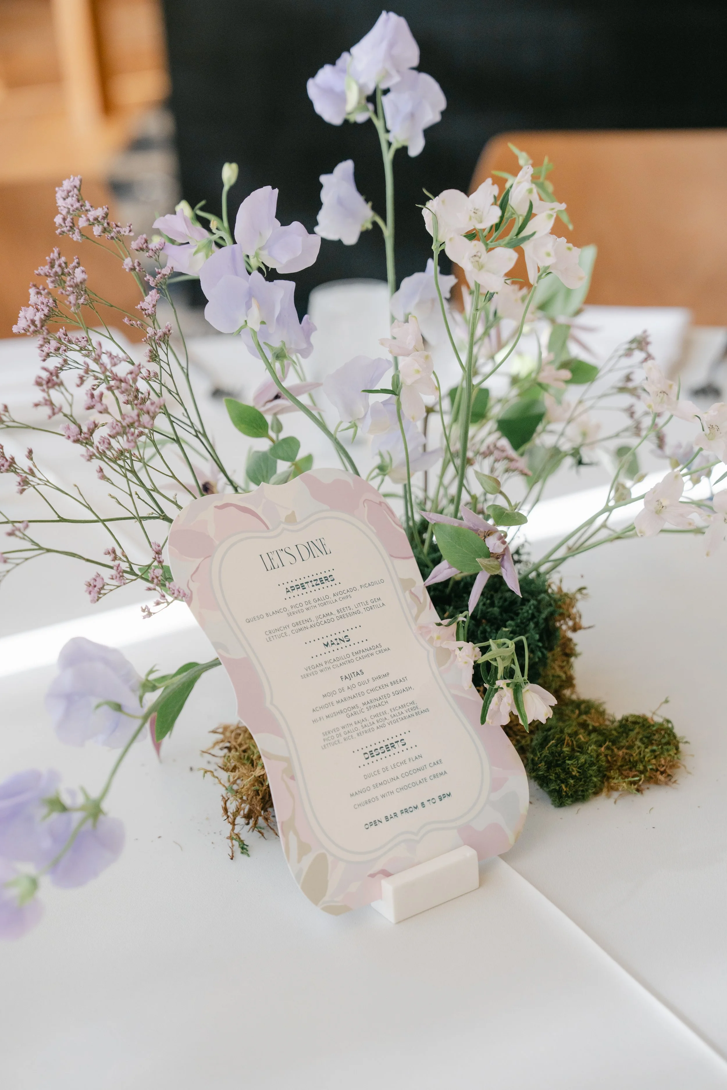  Soft pastel sangeet florals by Remi + Gold with tree shadows on the windows at Austin Proper Hotel 