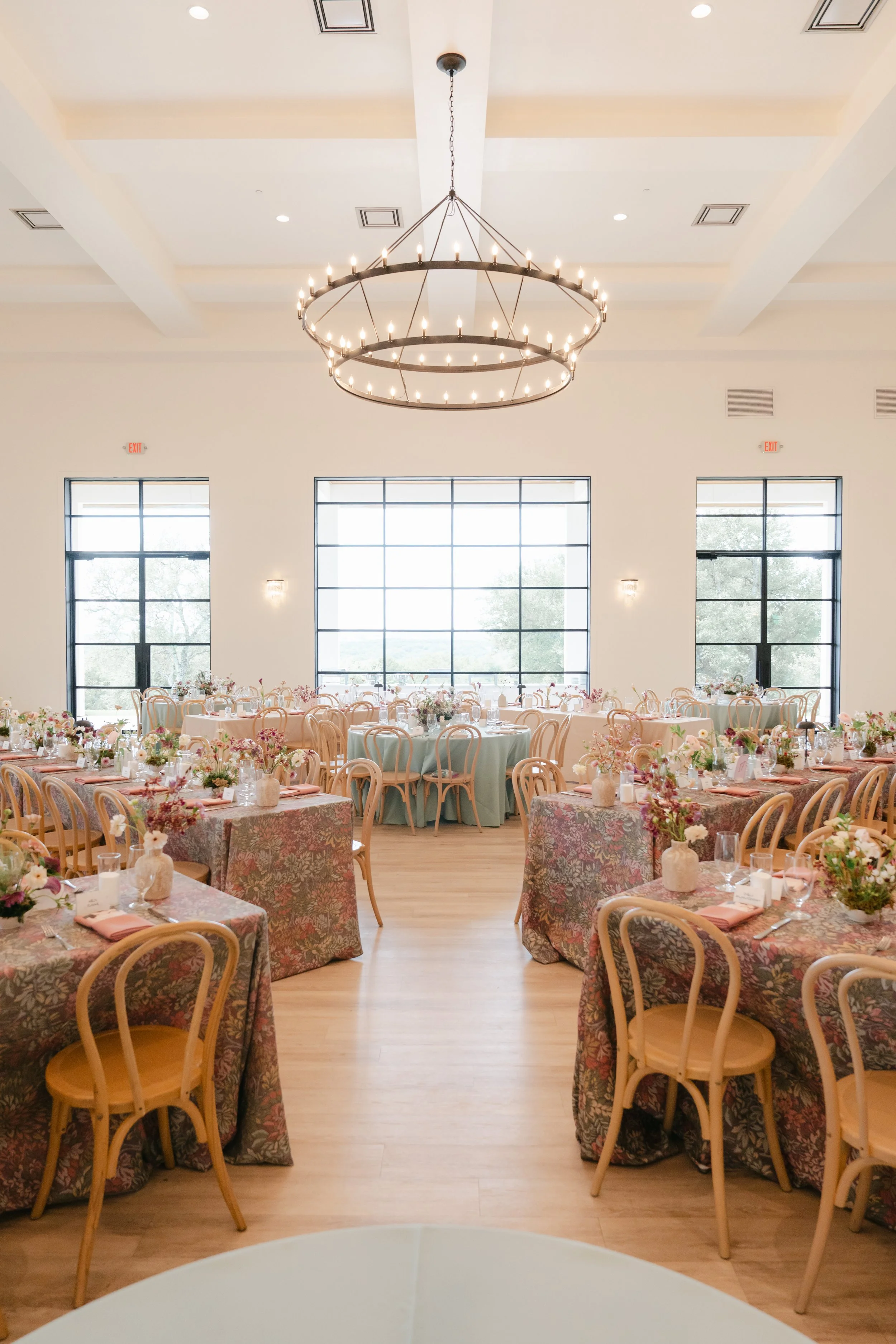  Wedding reception at The Arlo with burgundy and blush centerpieces under a ring chandelier 