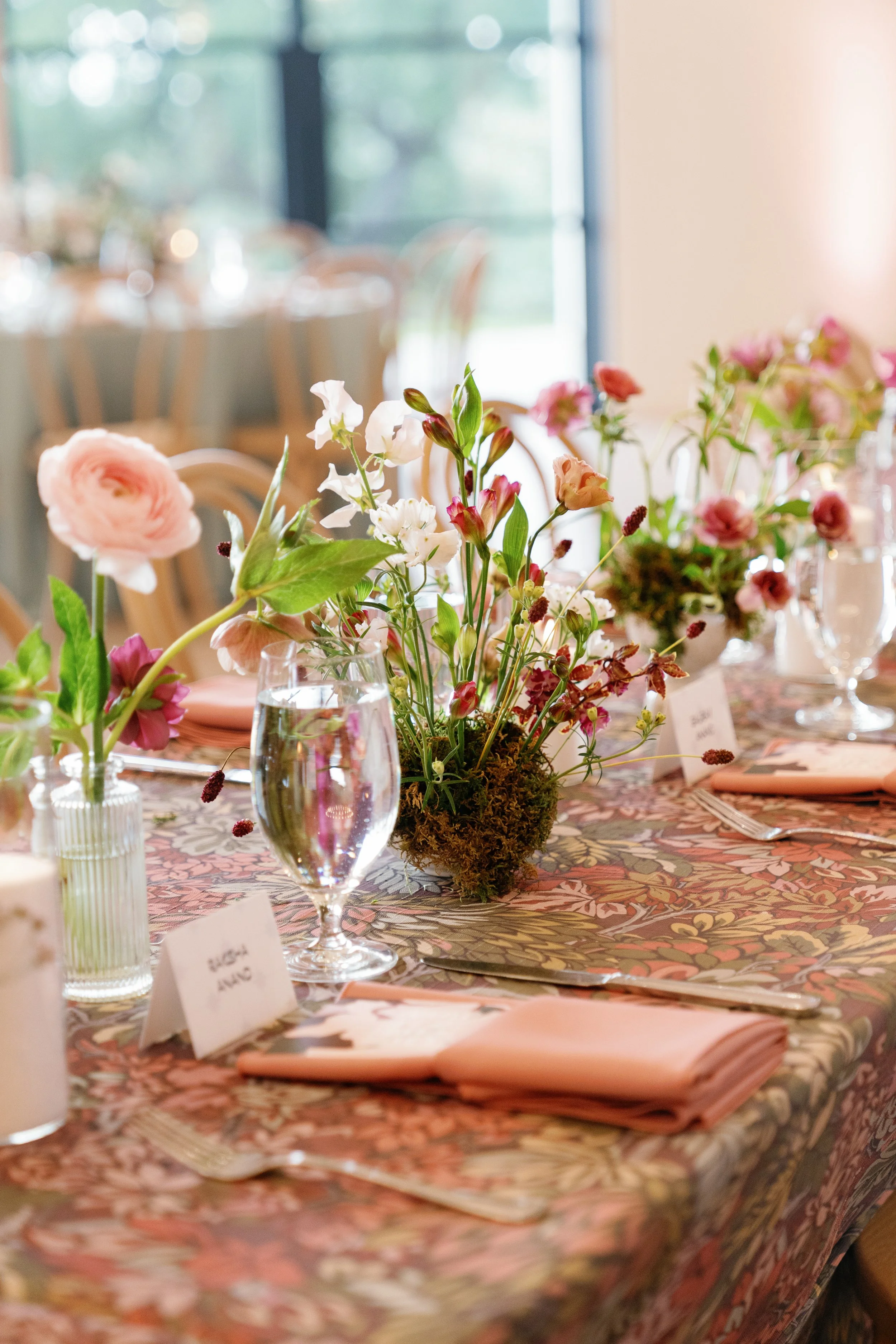  Reception tables in mauve and sage linens with loose floral centerpieces by Remi + Gold at The Arlo 