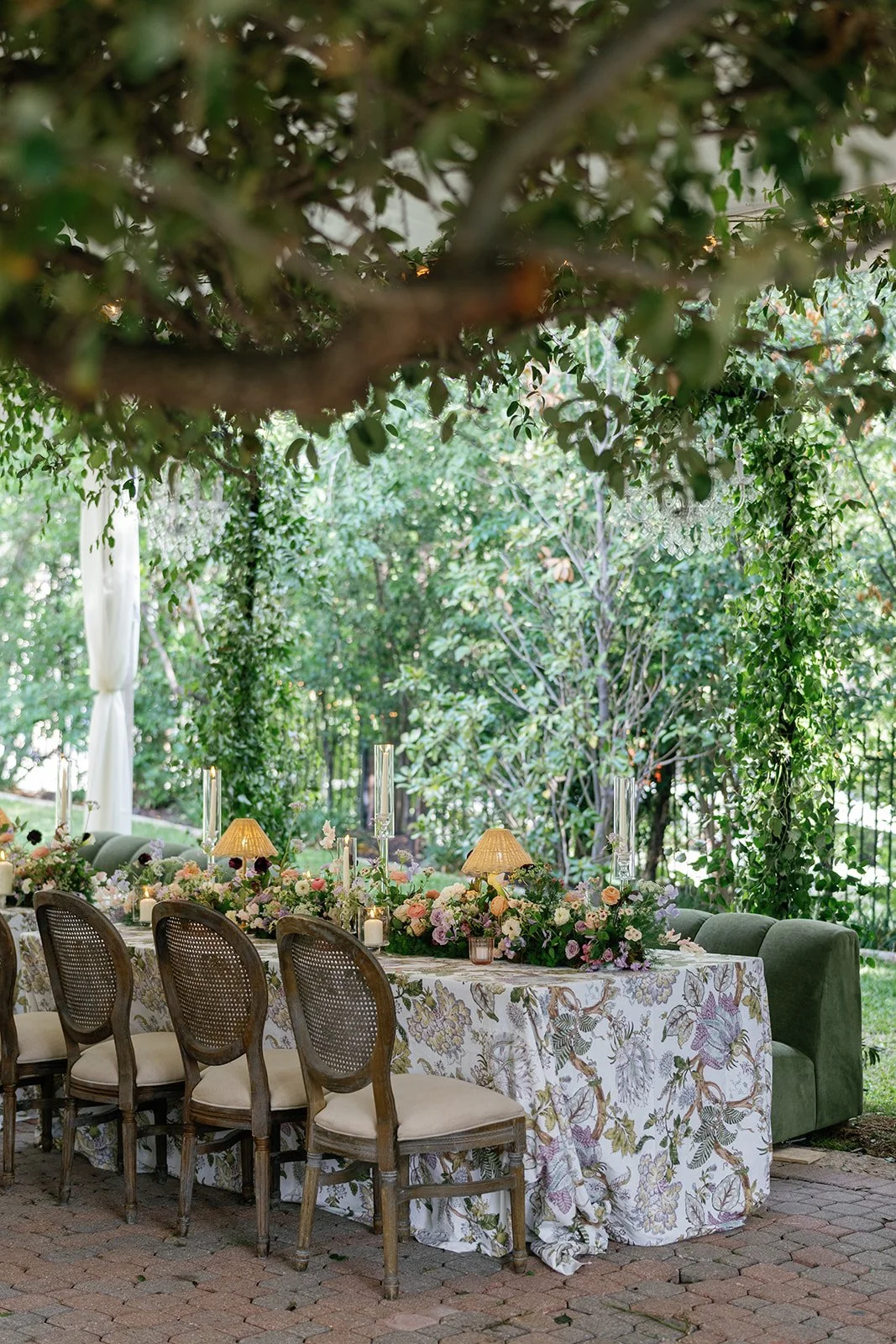  Tented wedding reception at The Allan House with a hanging greenery canopy and string lights, designed by Remi + Gold 