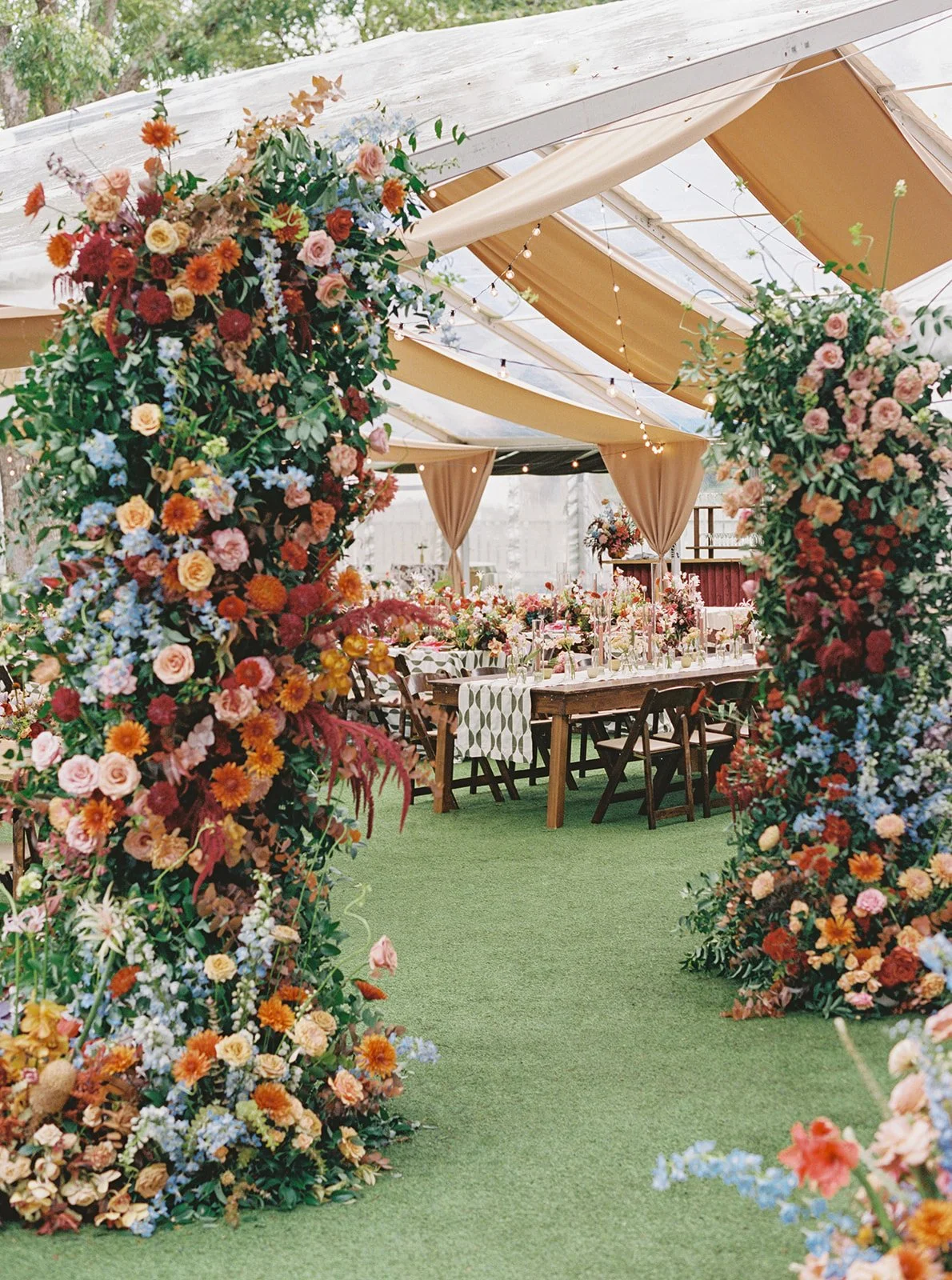 Floral tented entrance created by luxury wedding florist