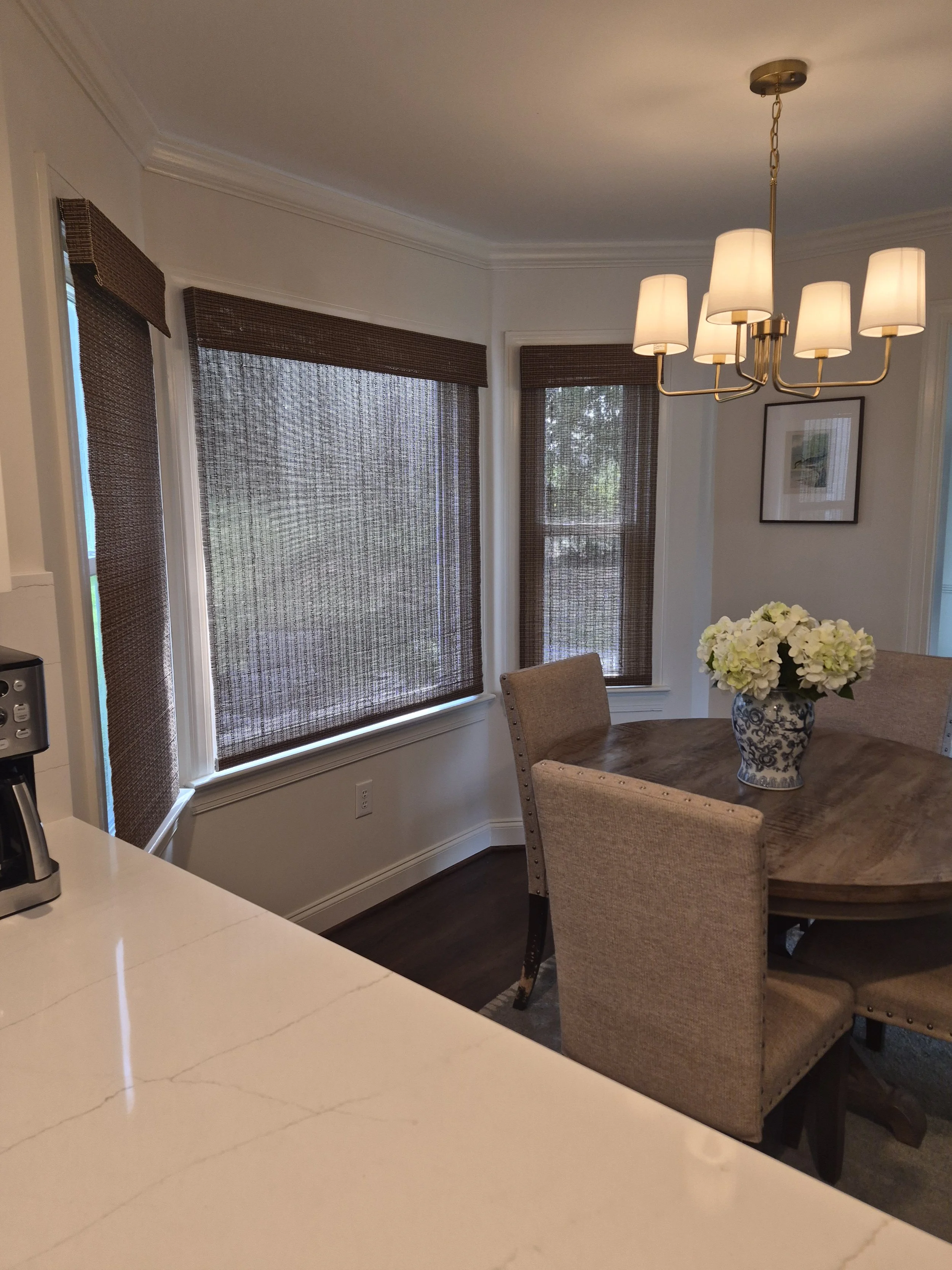 Woven Wood Roman Shades in bay window